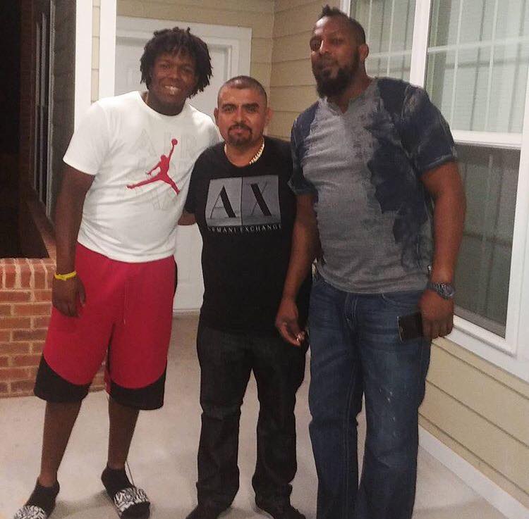 Jesse Guerrero (middle) is not related to Vladimir Guerrero (right) or Vladimir Guerrero Jr. (left) but he has worked tirelessly behind the scenes for the former Montreal Expos slugger for more than two decades. Photo Credit: Jesse Guerrero