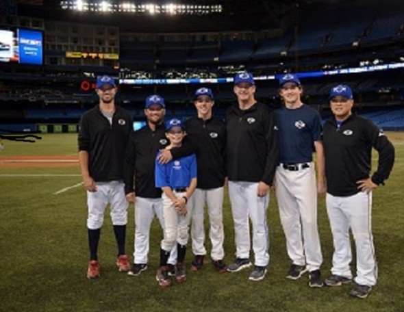 The Rogers Centre was not re-named the Spoljaric Centre … it only seemed that way during Tournament 12 in 2014. Futures Navy coach Chris Begg (from left to right), former workhorse for Team Canada, coach Stubby Clapp, Prime Minister of Canadian baseball on the international stage; Turner Spoljaric, Garner Spoljaric, pappa Paul Spoljaric, former Jays reliever, Hunter Spoljaric, 16, and Hyung Cho, former Seattle Mariners farmhand. (Photo Credit: Alexis Brudnicki).
