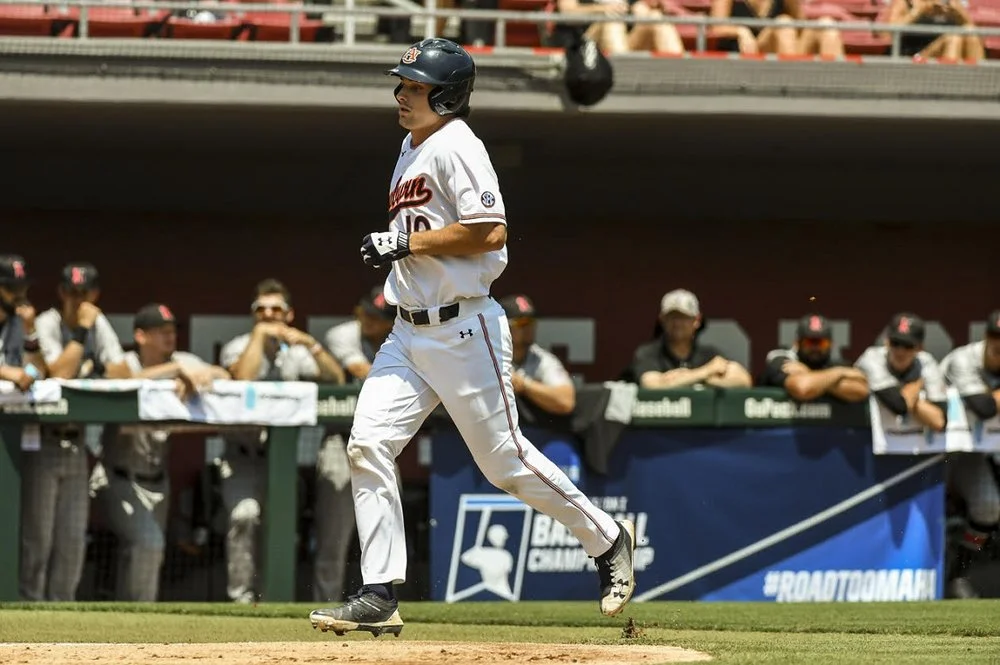 Julien knocks in two to lead Auburn to win in opener