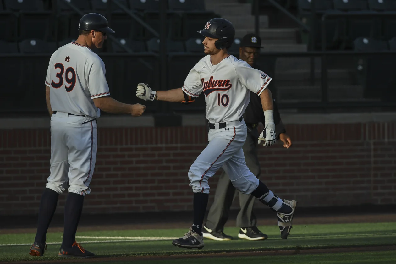Julien homers, knocks in three in Auburn loss