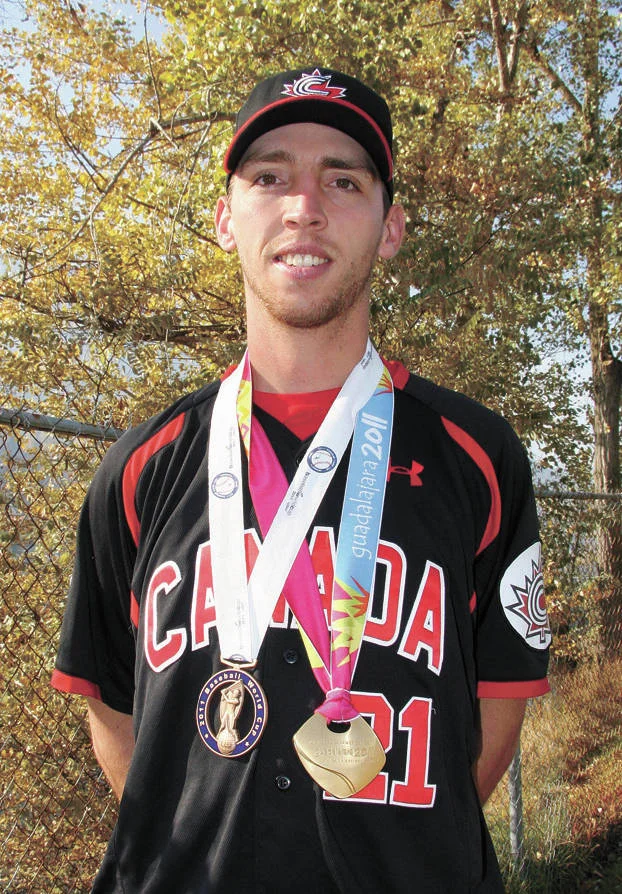 Former Team Canada pitcher Chris Kissock (Trail, B.C.) is shown here with his gold and bronze medals from the 2011 Pan Am Games and World Cup. Photo: Trail Times