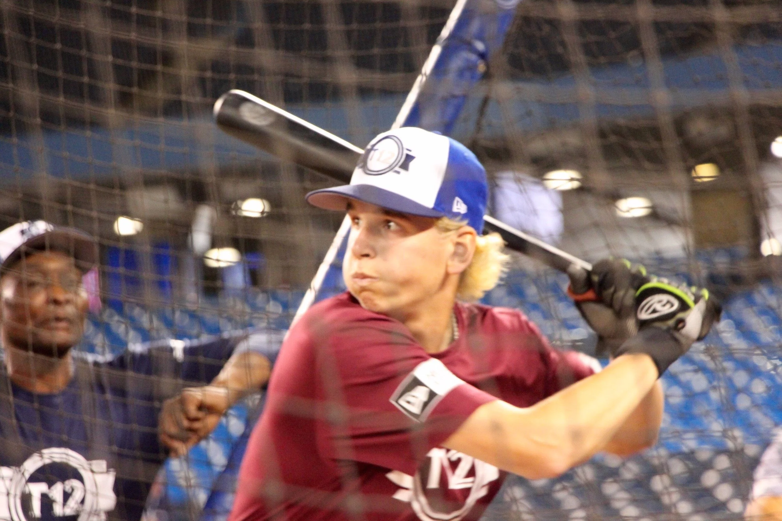Vauxhall Jets 2B Nick Gravel (Fall River, NS) helped his Nova Scotia team to an upset win over Ontario as Blue Jays alumni Lloyd Moseby watches. Photo: Tyler King.