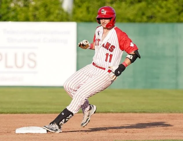 Holyk homers, drives in three for Titans in win