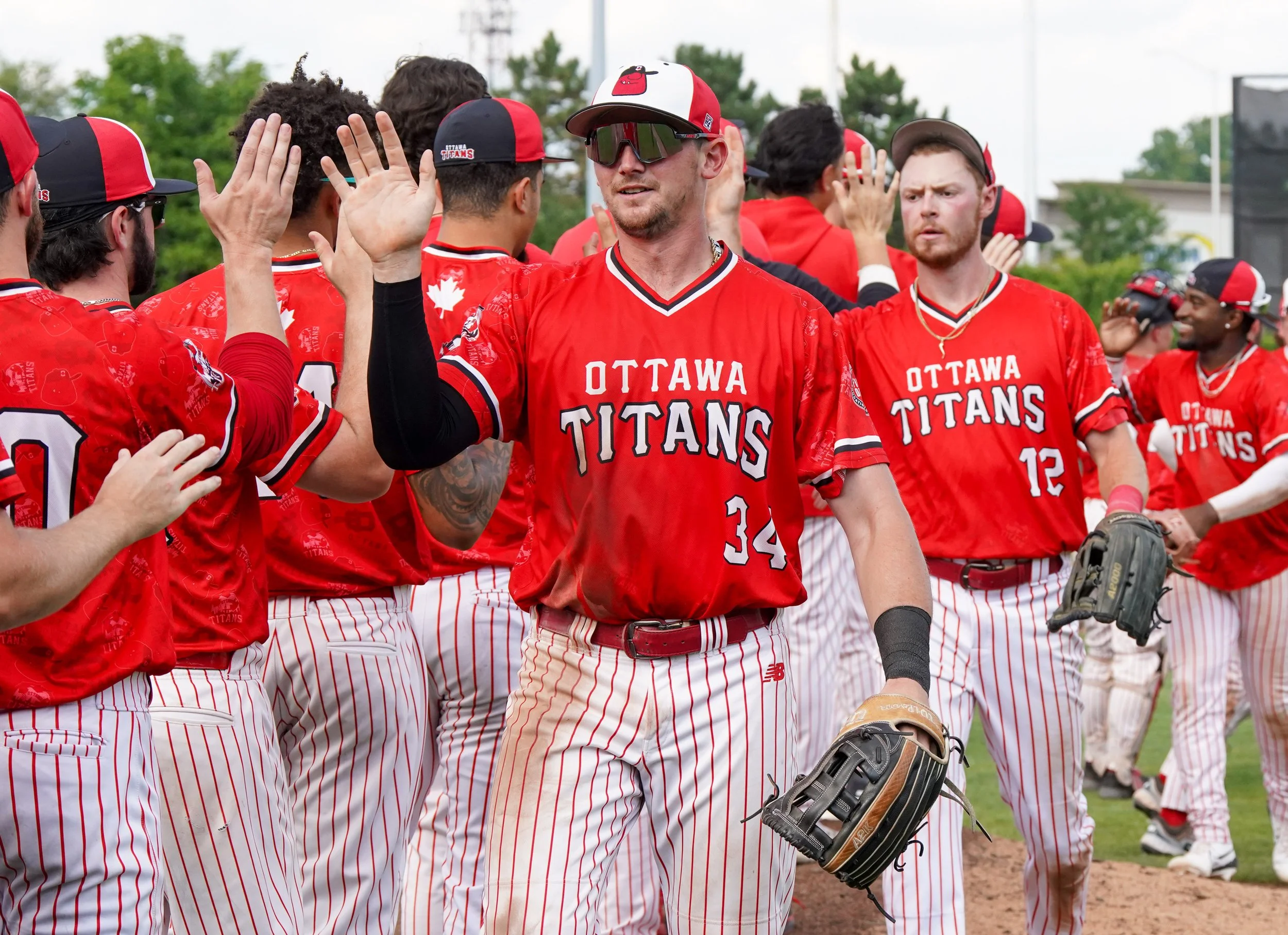 Sanford knocks in three to lead Titans to win