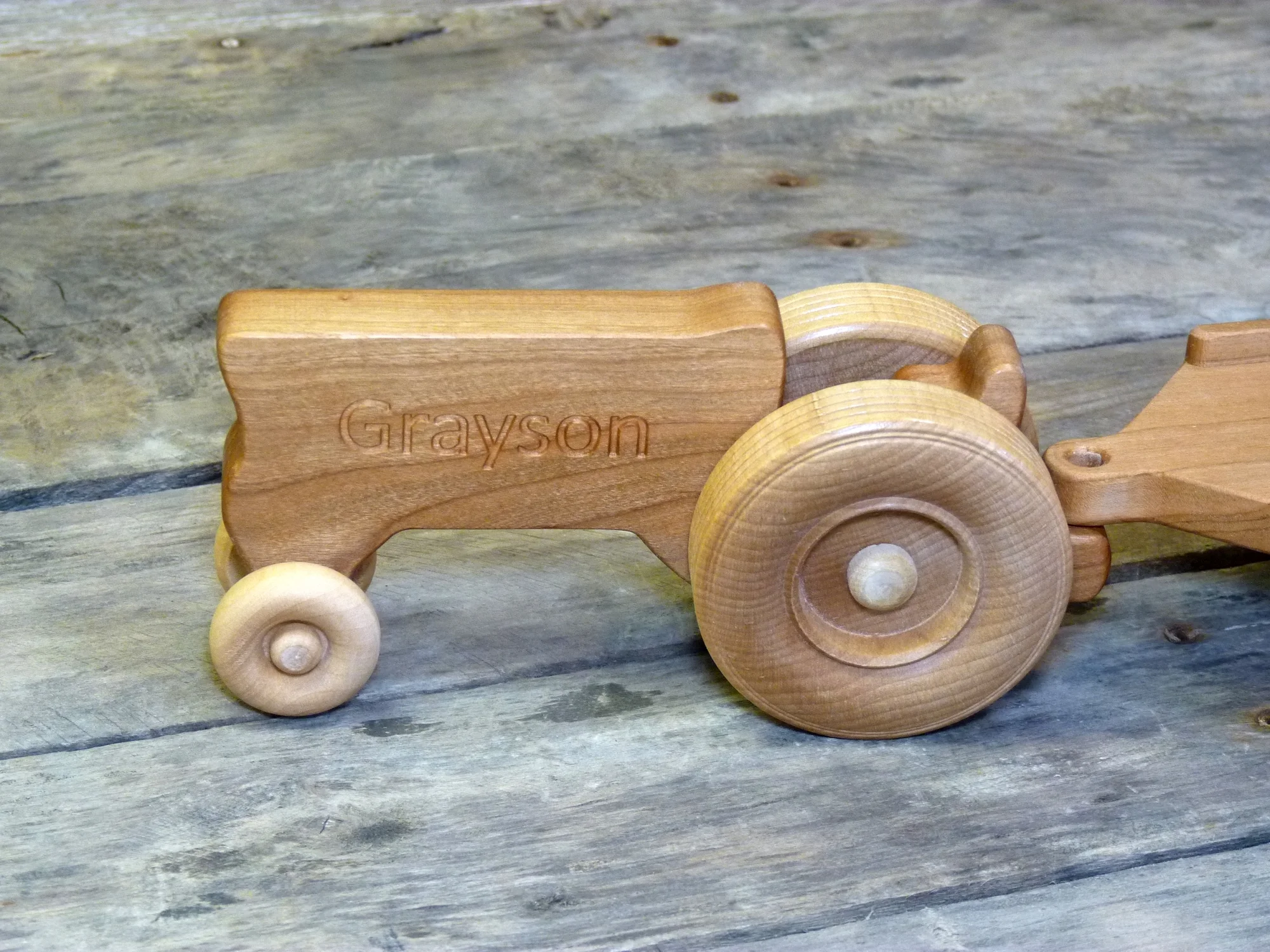 Handmade wooden toy tractor, personalized with a child's name