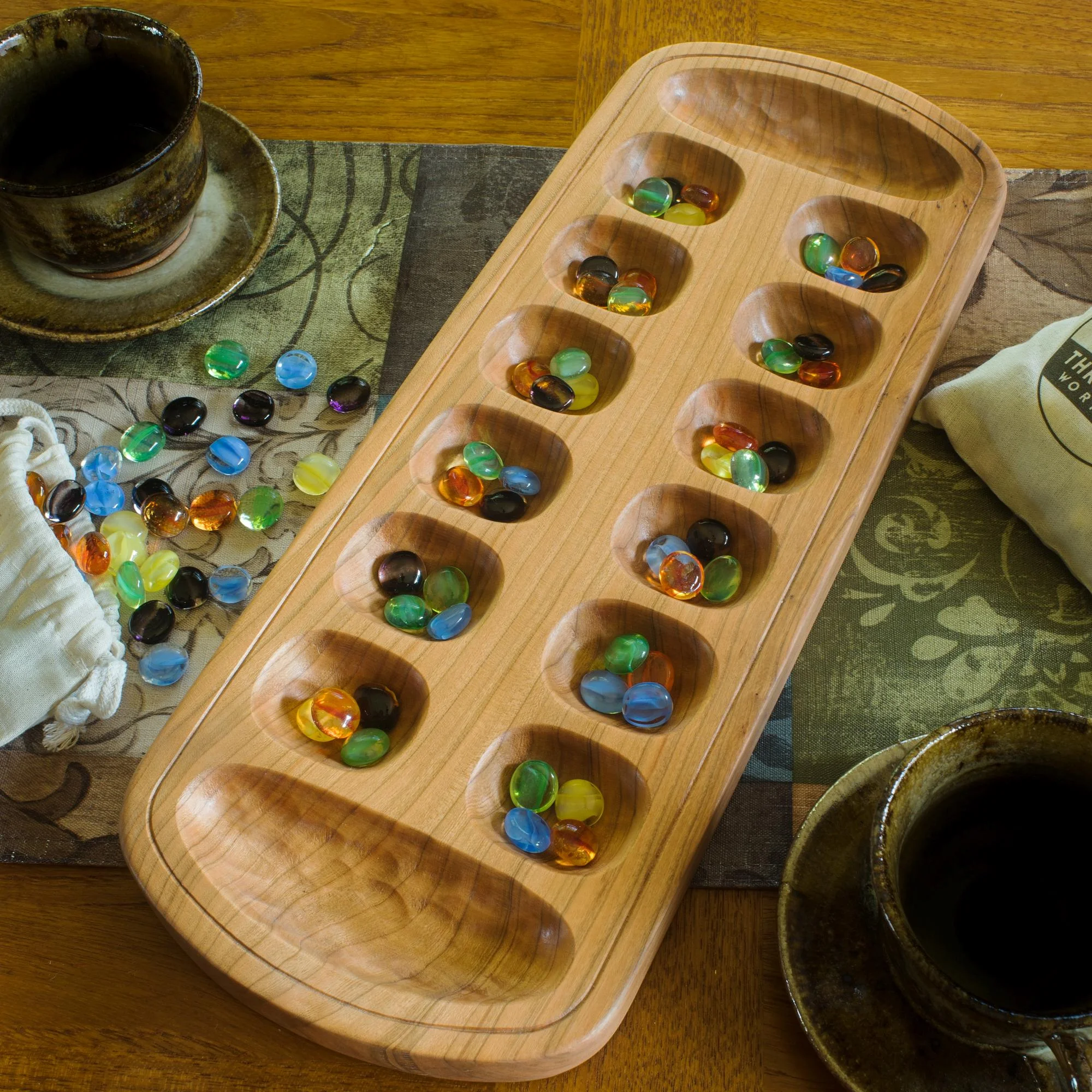 Handmade wooden mancala board from solid cherry