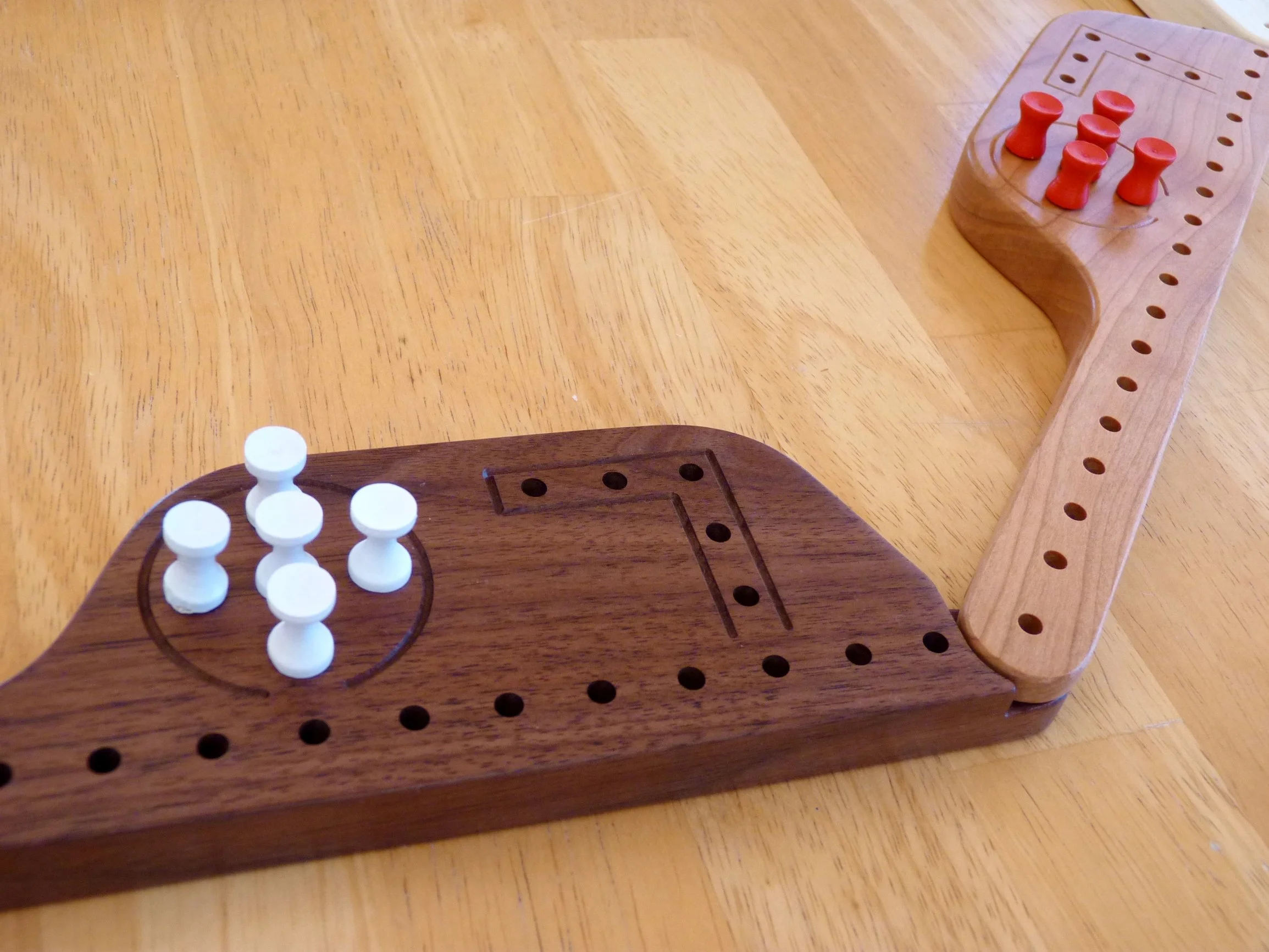 Interlocking wooden paddles for Pegs and Jokers