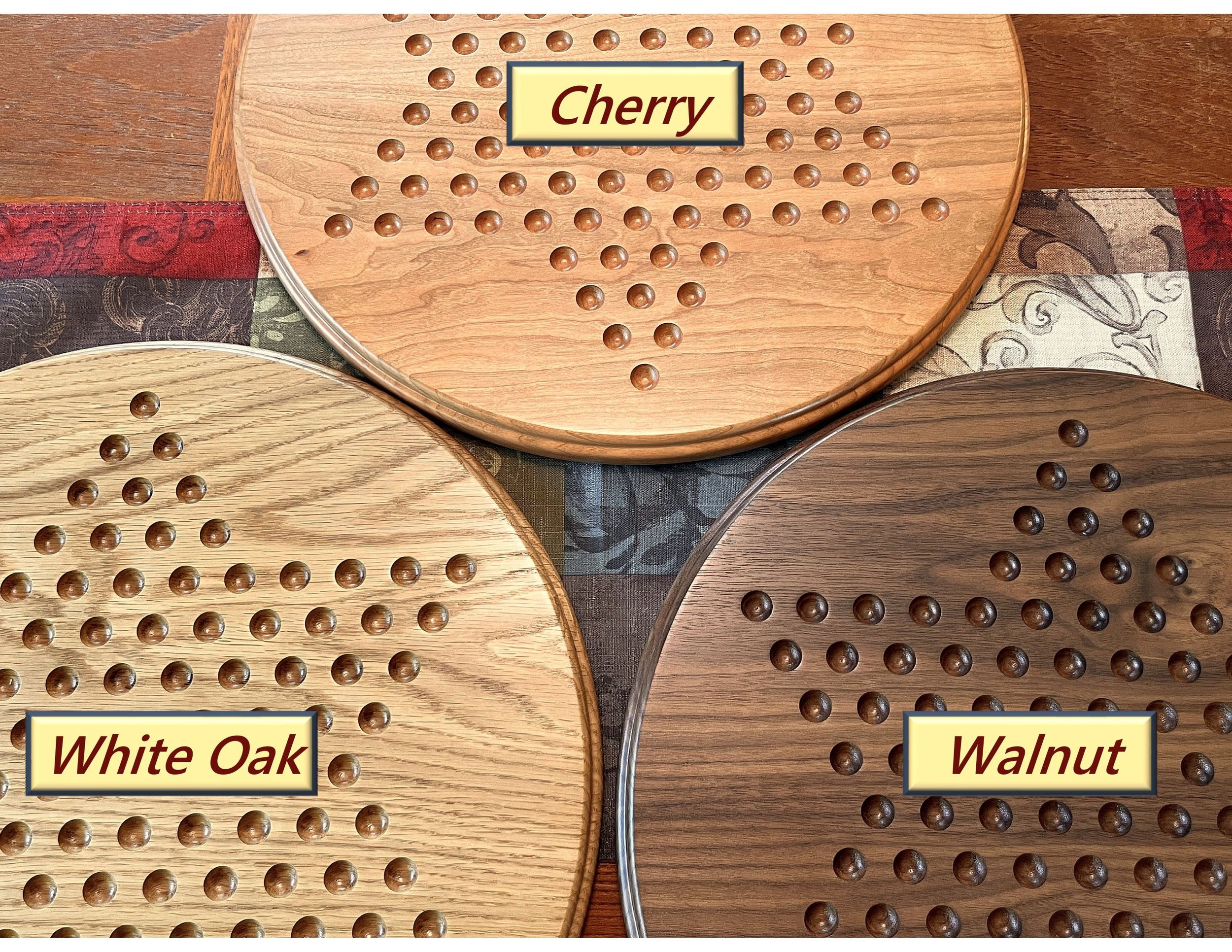 Three Chinese checkers boards side by side, labeled as walnut, white oak, and cherry.