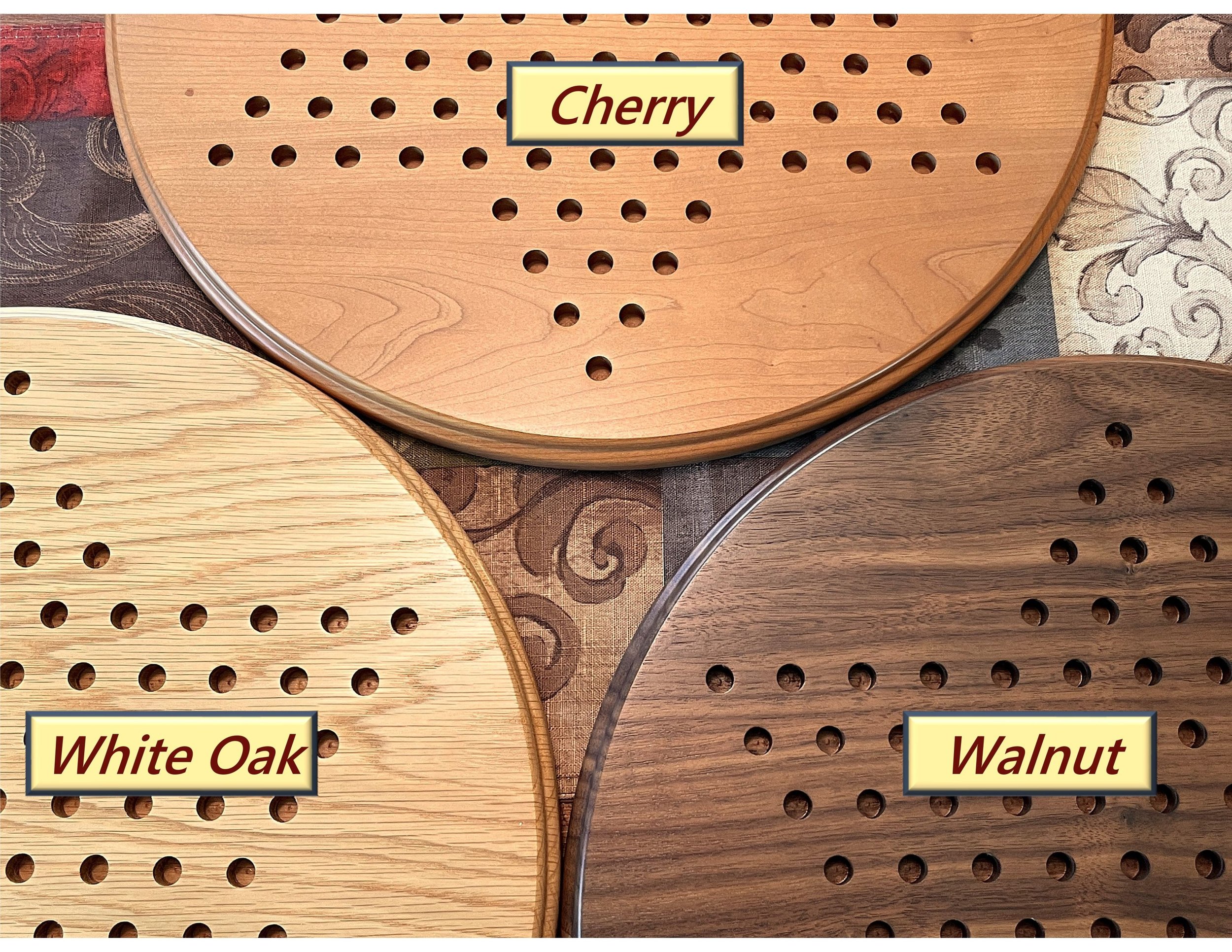 Three Chinese checkers boards side by side showing the different woods - walnut, oak, and cherry.