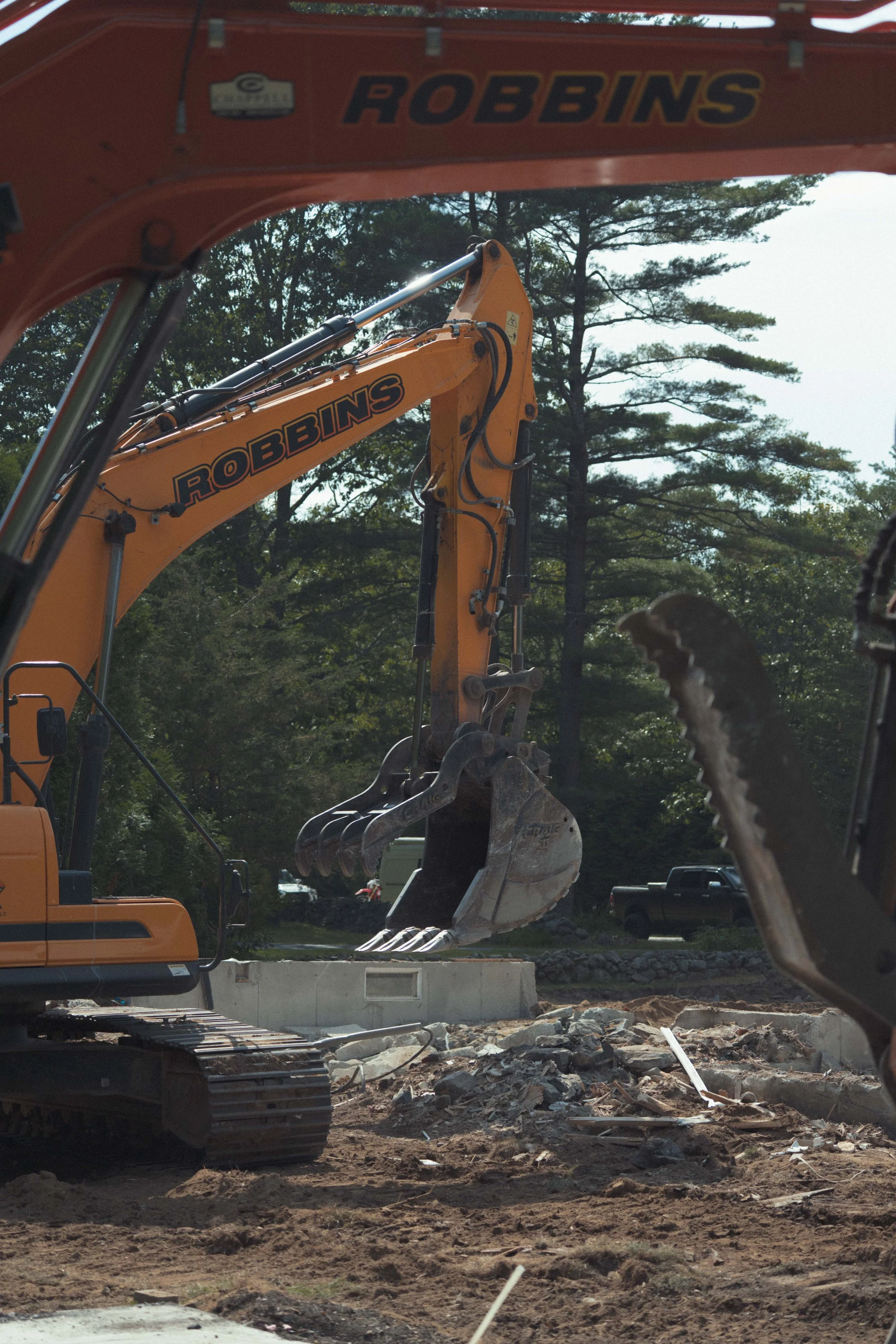 excavator moving debris on jobsite