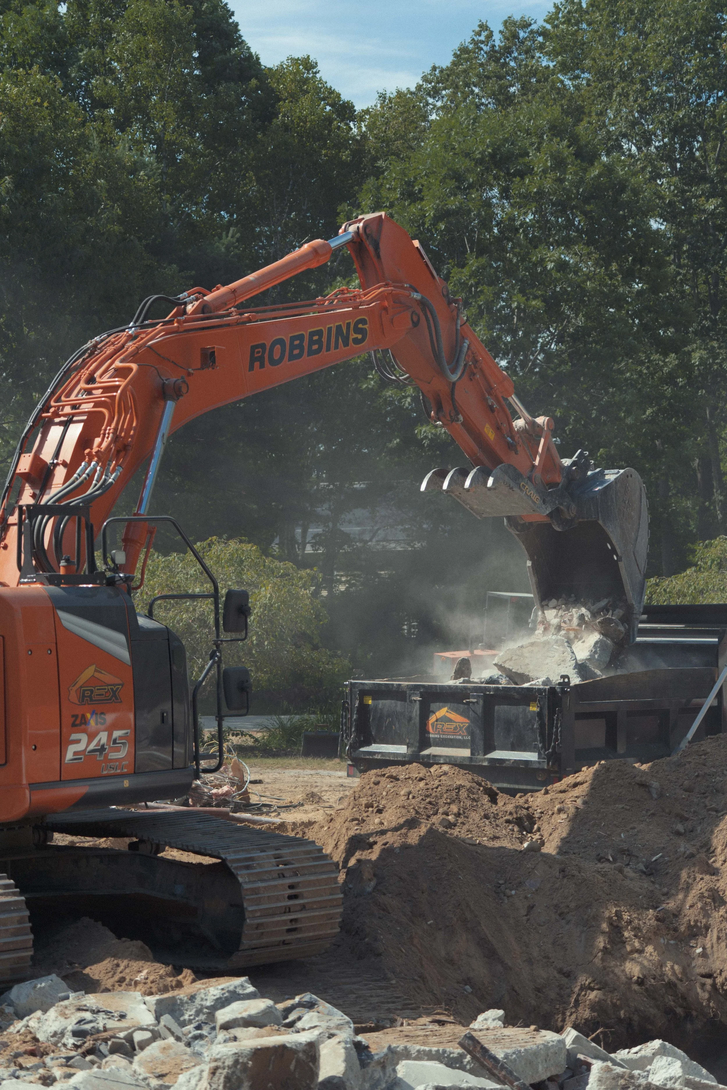 excavator bucket dropping debris