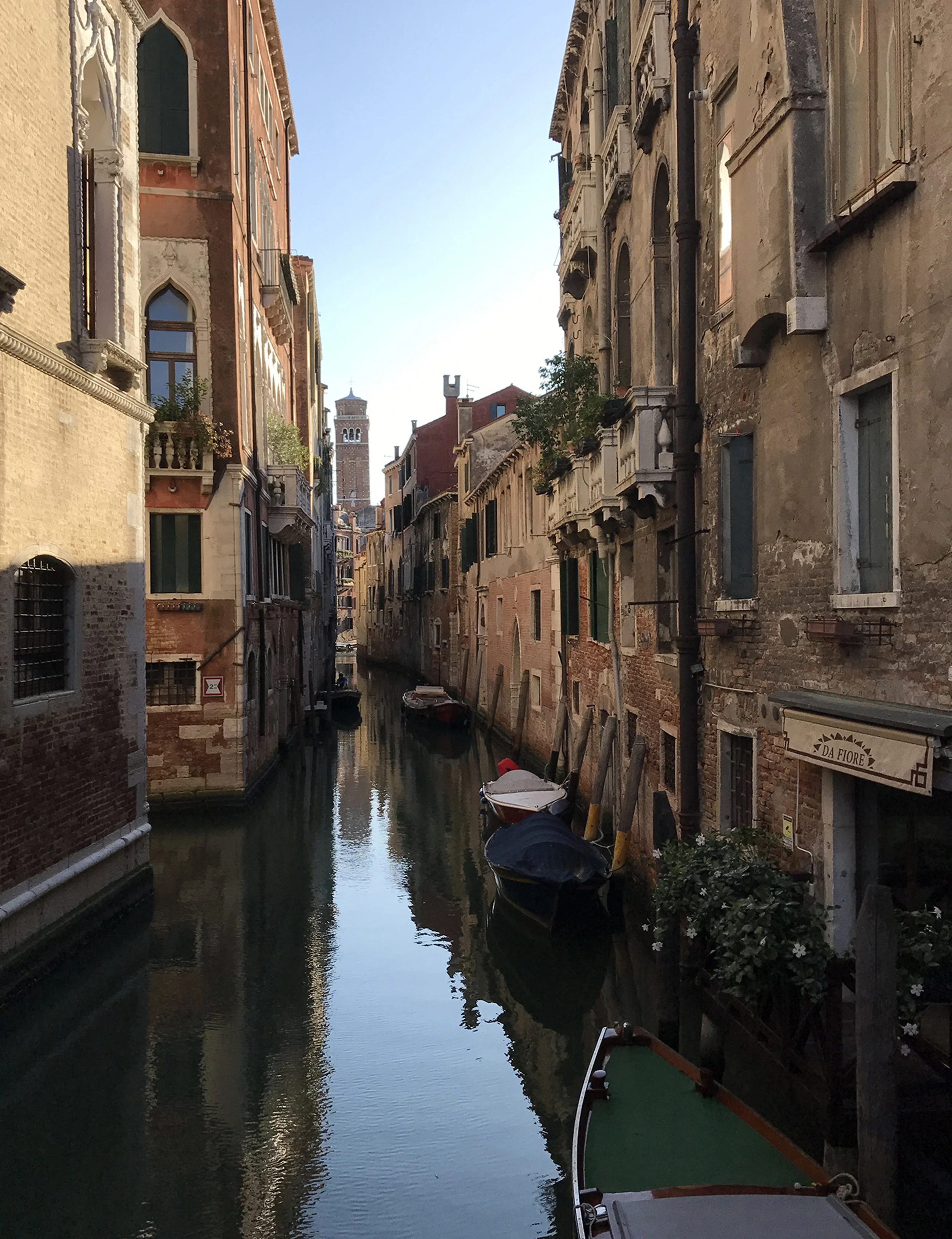  A quiet afternoon in Venice, Italy  In the far background, the bell tower of Santo Stefano 