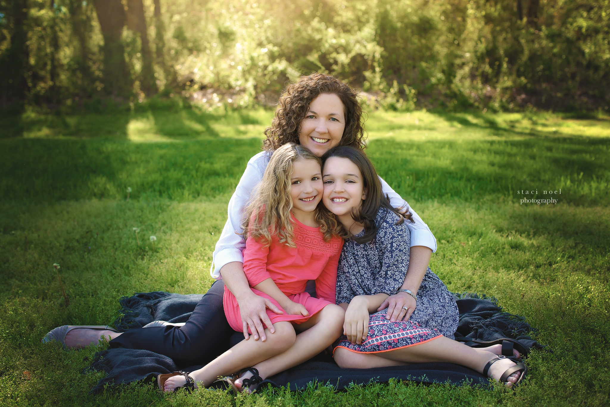  charlotte's best family photographer staci noel photographer captures family images iof mother and daughters in park setting outdoors in natural light 