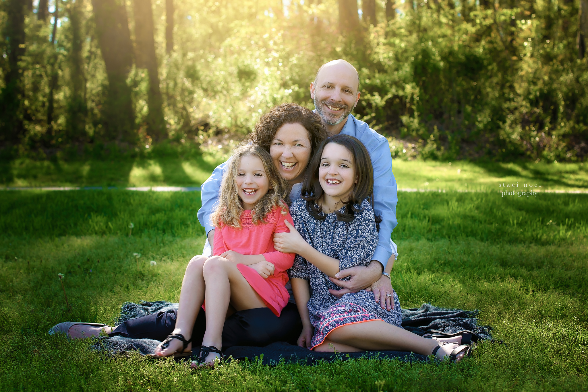  charlotte's best family photographer staci noel photographer captures family images iof mother and daughters in park setting outdoors in natural light 