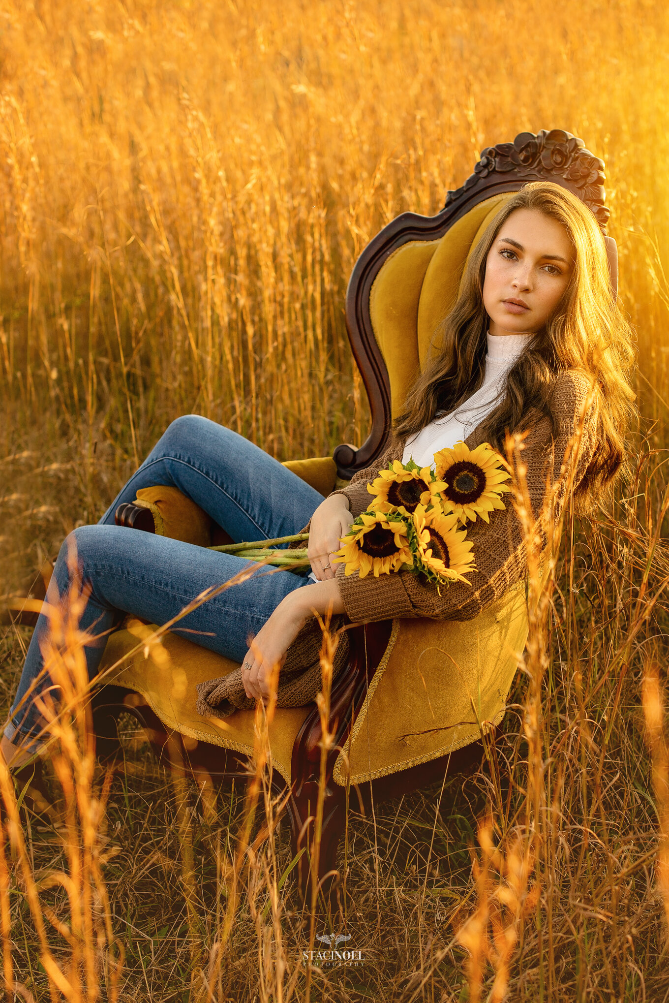  Staci noel photography photographs hickory ridge senior girl for senior portraits outside in natural light in field with tall grass and sunset and sunflowers 