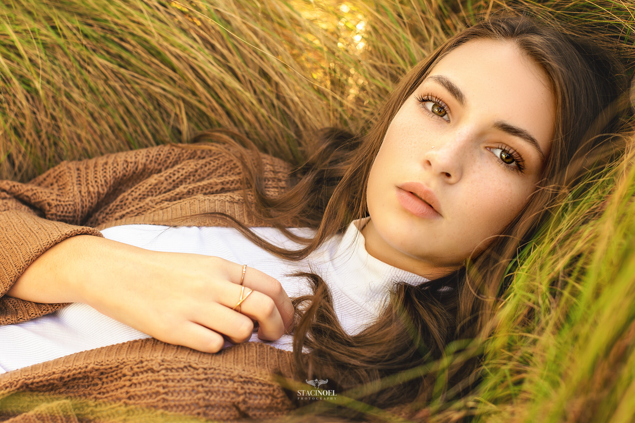  Staci noel photography photographs hickory ridge senior girl for senior portraits outside in natural light in field with tall grass and sunset 