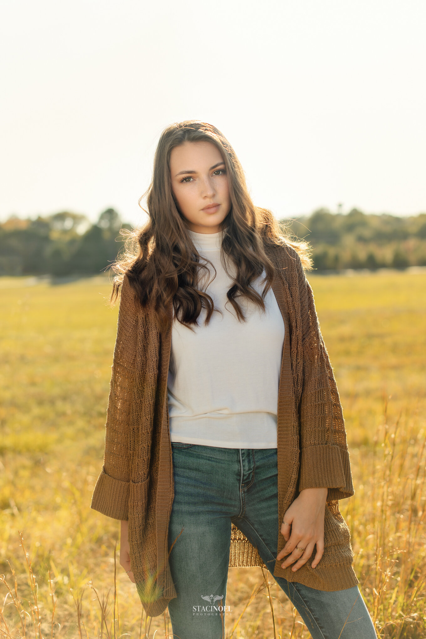  Staci noel photography photographs hickory ridge senior girl for senior portraits outside in natural light in field with tall grass and sunset 