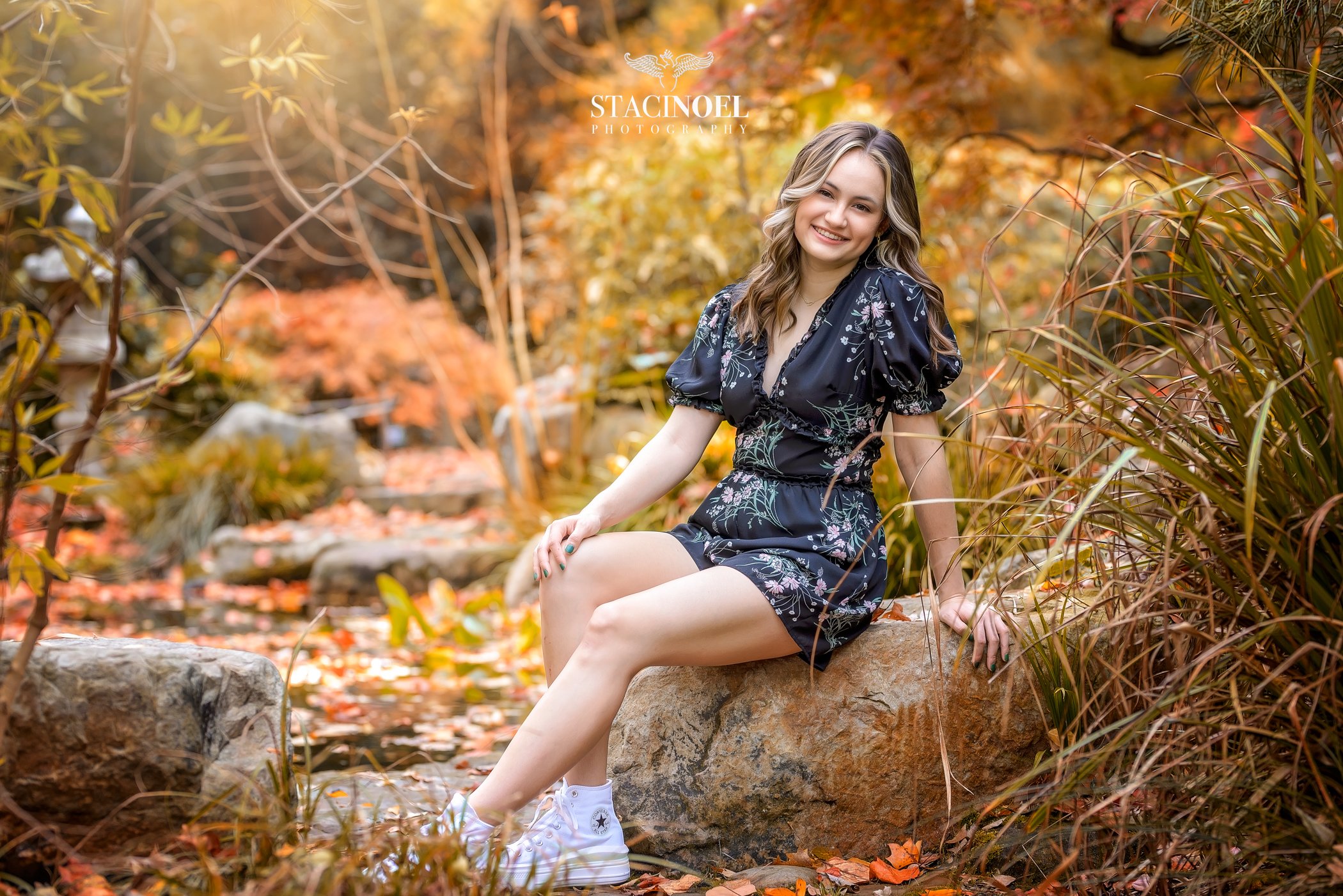 Charlotte senior photographer Staci Noel photography captures a fall senior session at UNCC botanical gardens with autumn colors and high school senior girl in beautiful outdoor setting