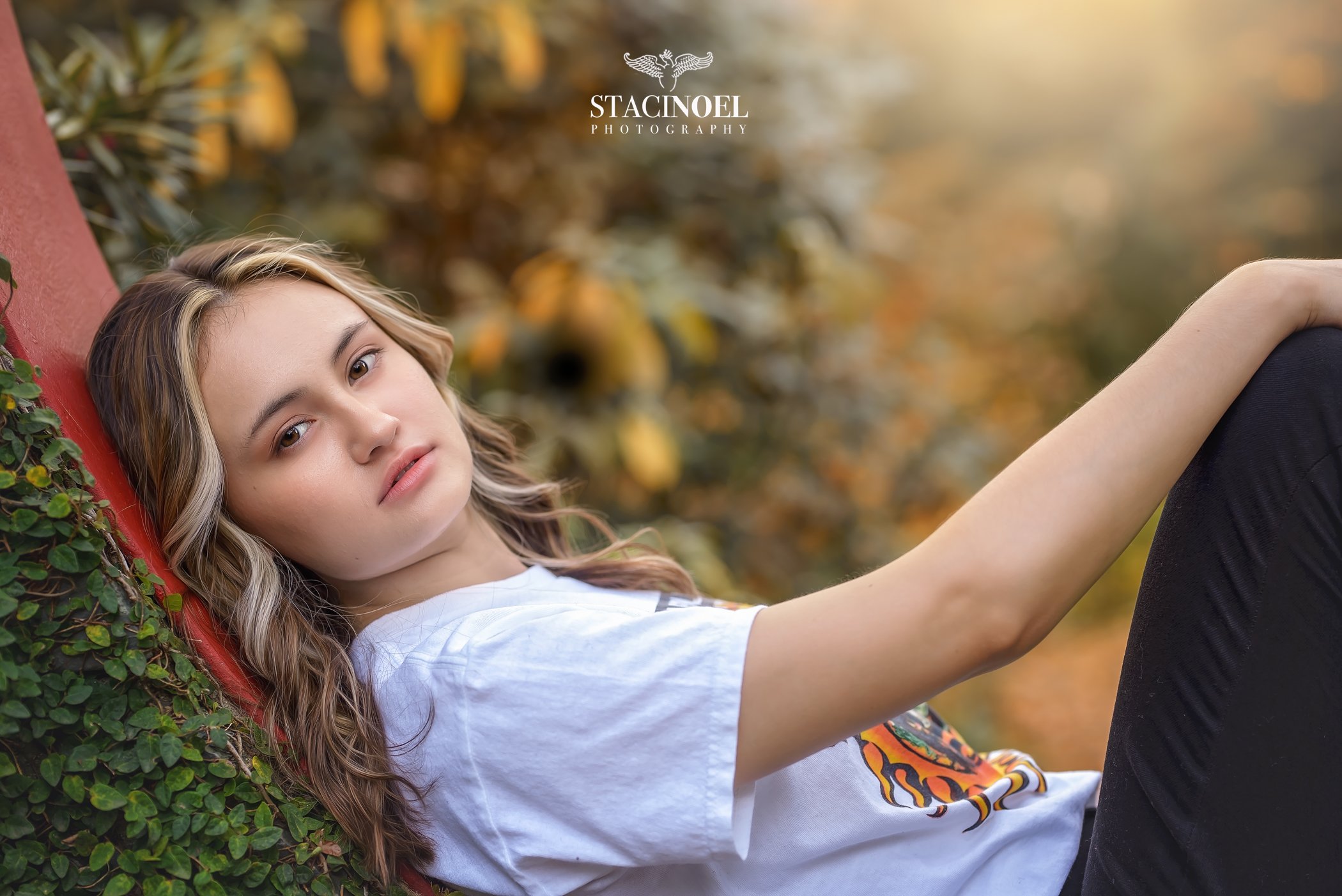  Charlotte senior photographer Staci Noel photography captures a fall senior session at UNCC botanical gardens with autumn colors and high school senior girl in beautiful outdoor setting 