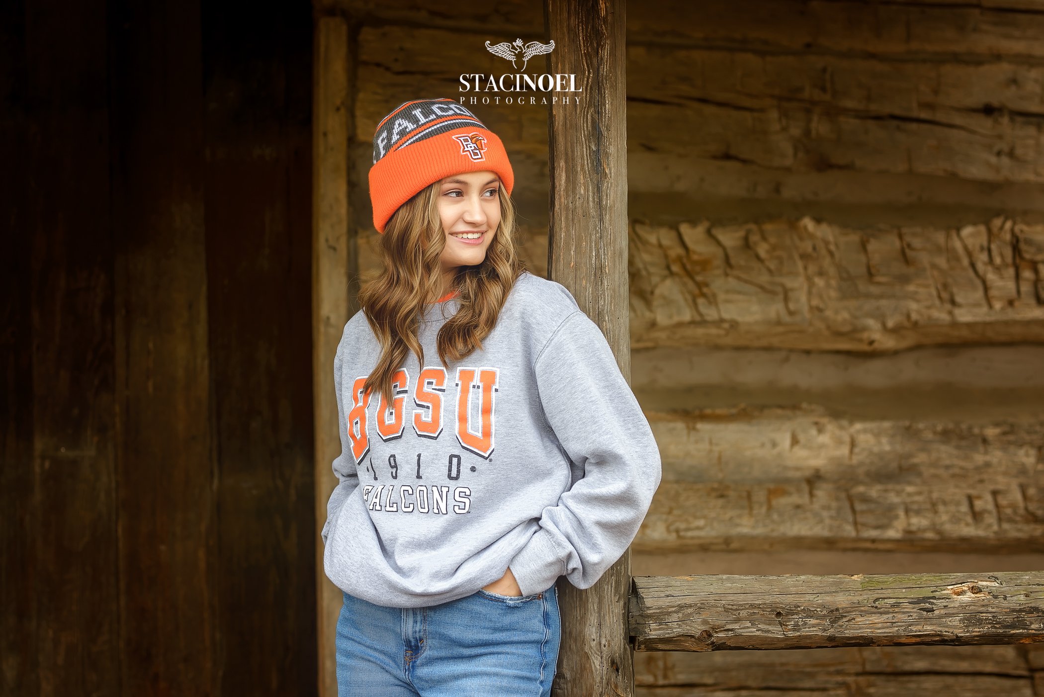  Charlotte senior photographer Staci Noel photography captures a fall senior session for high school senior girl in beautiful outdoor setting with college gear 