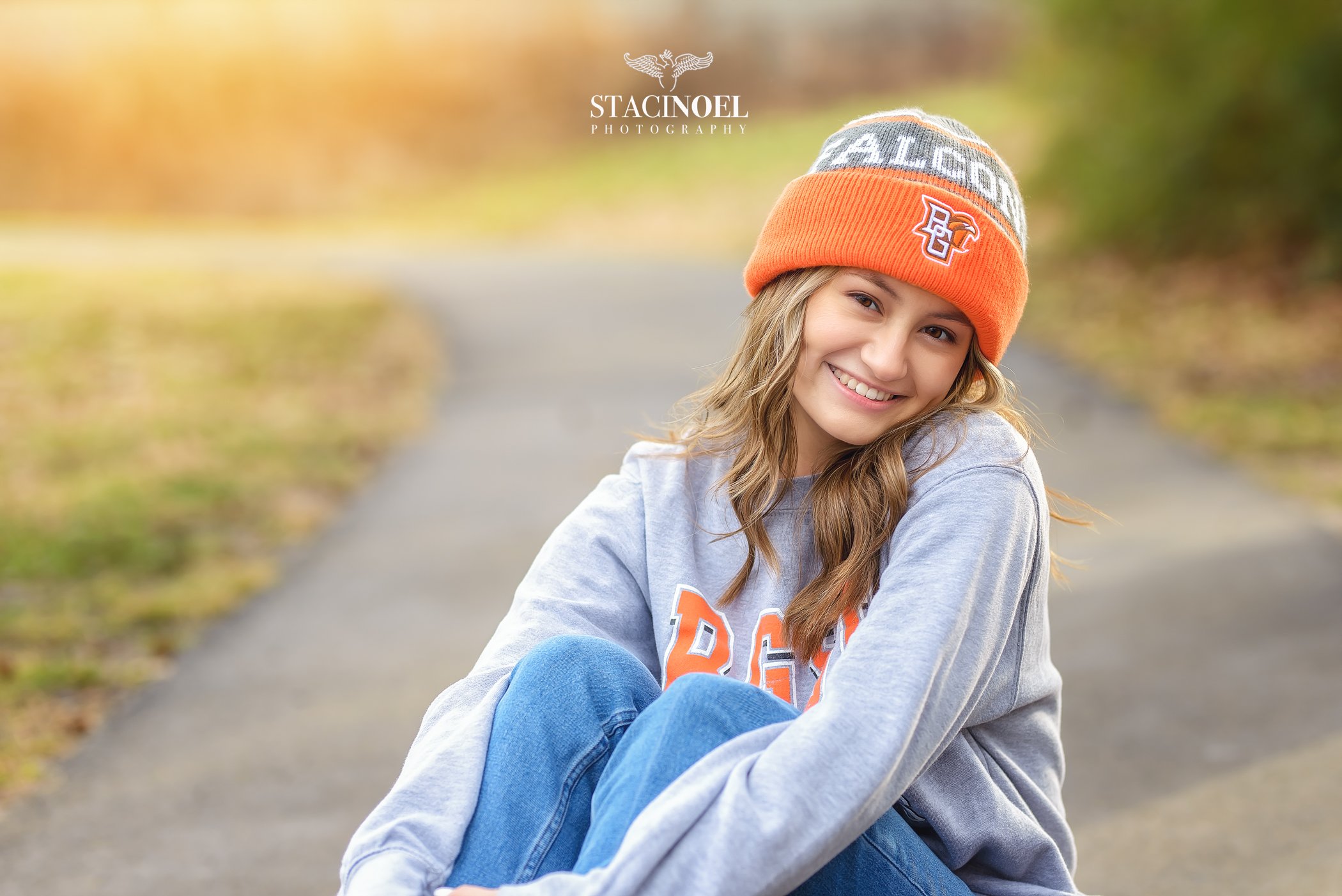  Charlotte senior photographer Staci Noel photography captures a fall senior session for high school senior girl in beautiful outdoor setting with college gear 