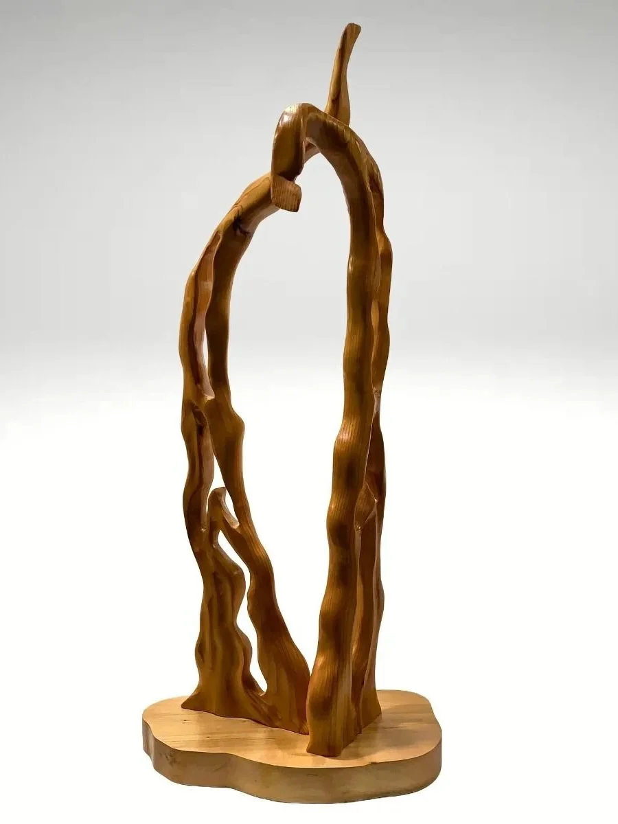Abstract wooden sculpture on white background