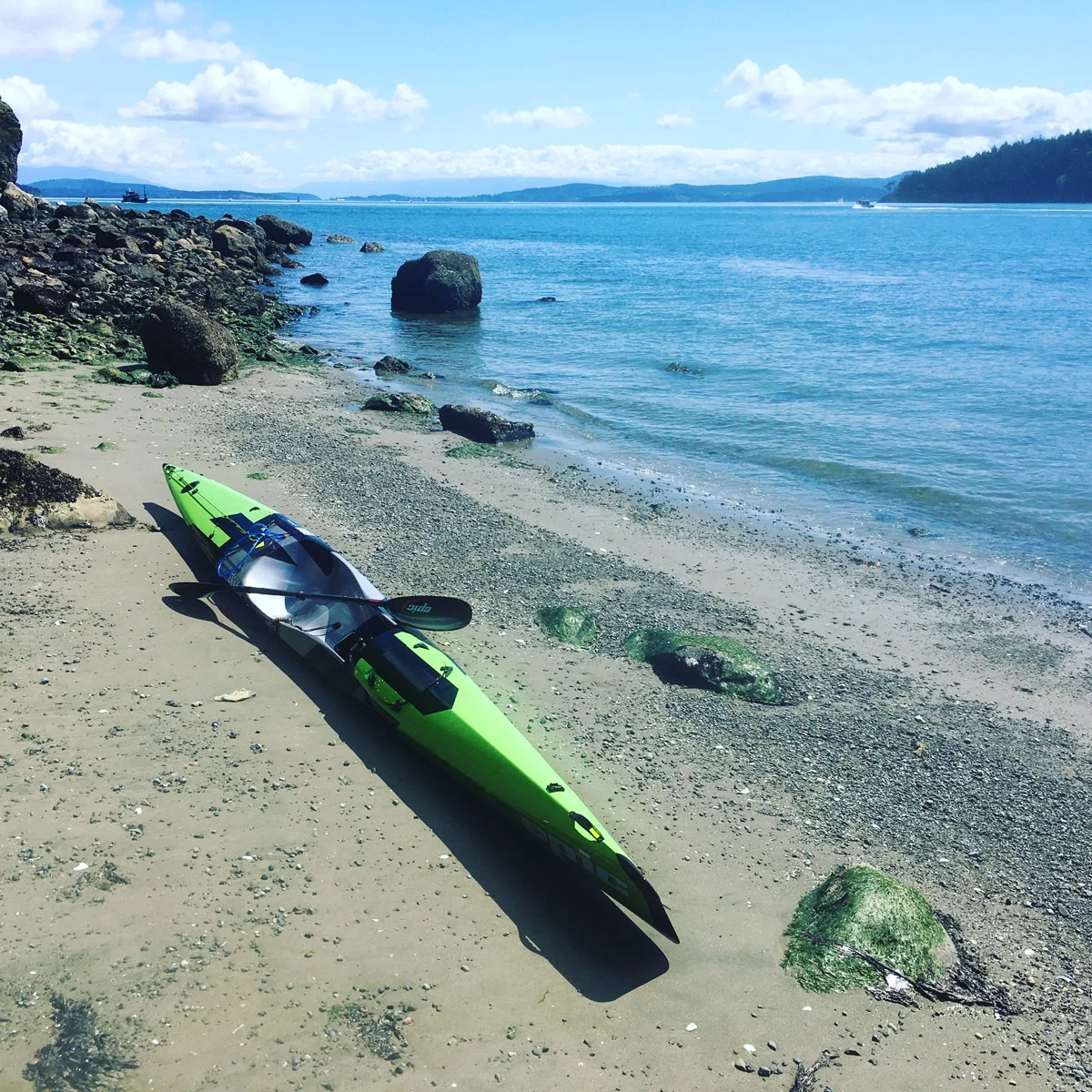 A helpful hint if you are thinking about touring the San Juan Islands: The steep bluffs often have deposits of sand at their base, making for excellent and private low tide stop overs. Not an option for camping (use the state parks for that) but a great way to take a break as you work the islands on a long day. Just remember to haul your boat well away from the wave line as huge yachts and ferries can change a waterline pretty quickly. 