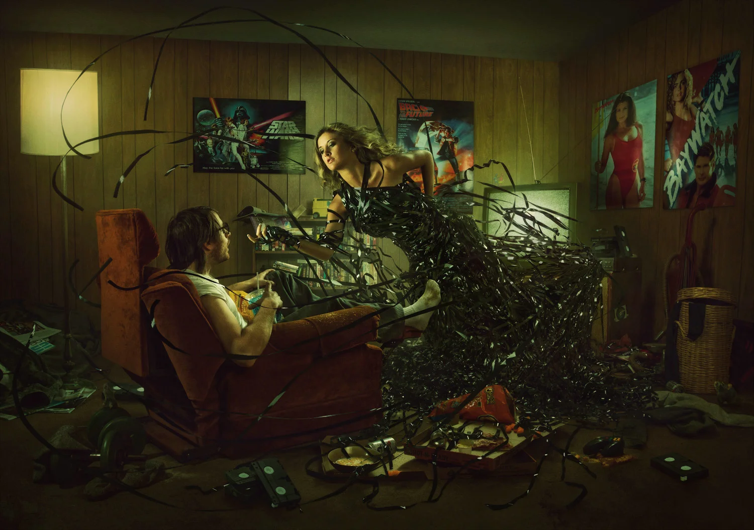VHS tape woman emerging from VCR into man cave