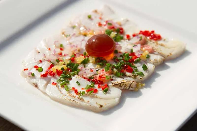 Torched Silver Trevally with preserved lemon, chives, pickled ginger, chilli, lemon myrtle dressing and soy sauce sphere