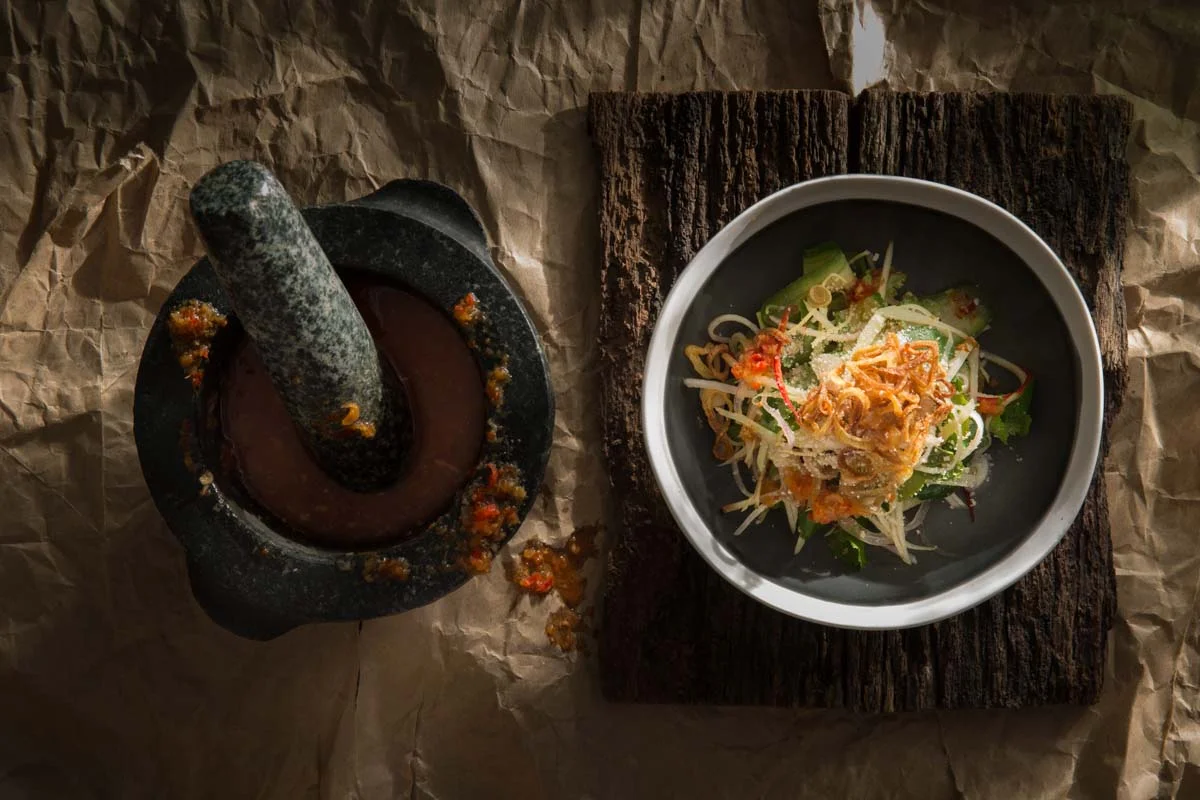 Green paw paw salad with crisp rice powder, fried eshallots and Namjim dressing