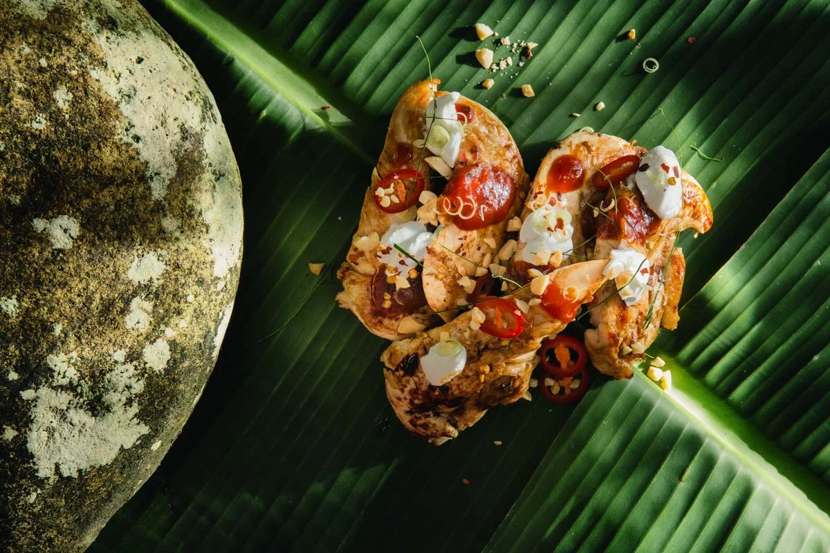 Barbecue chicken tenderloins with chilli jam, coconut cream, roasted peanuts, kaffir lime and lemongrass