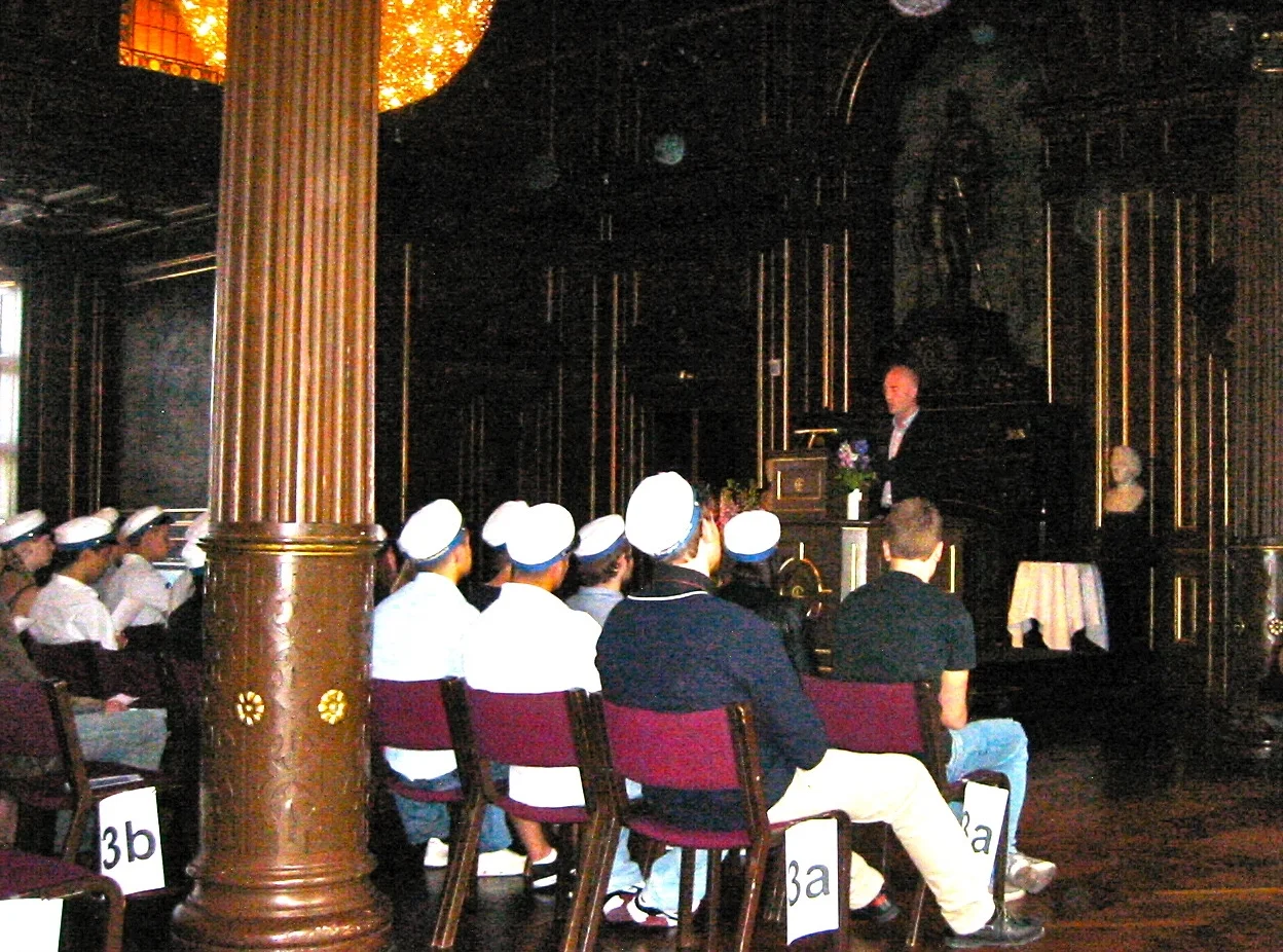 Mickey Beyer-Clausen delivering the commencement speech to graduating students of Niels Brock in 2010