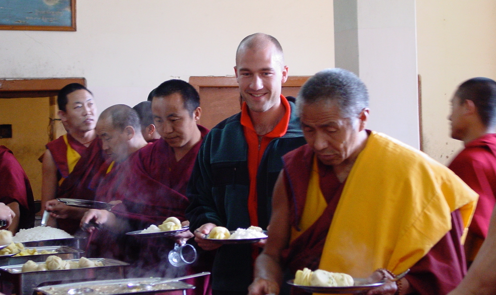 Mickey Beyer-Clausen eating lunch with the monks at Dalai Lama's Namgyal Monastery