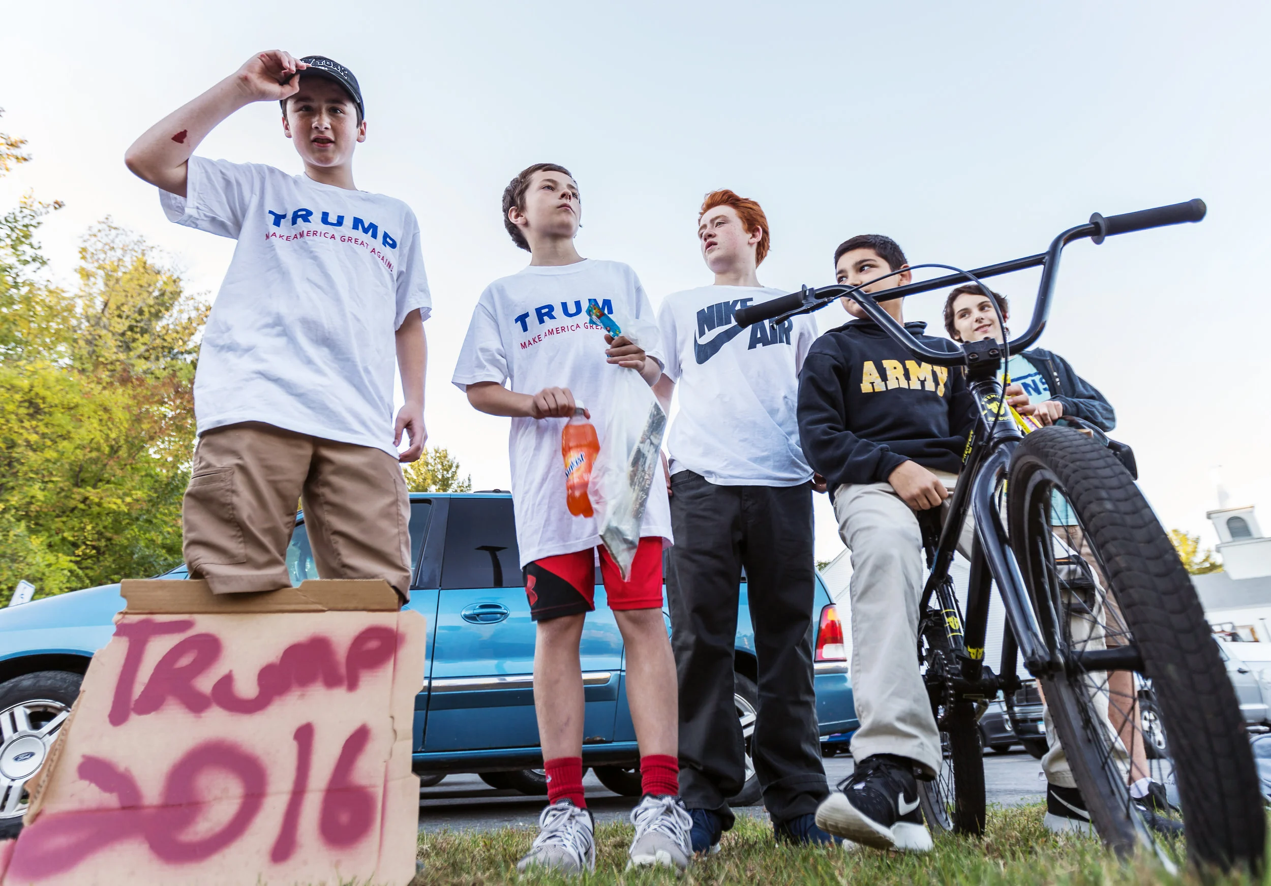 (From left) Nick Brennan, 14, Eric Jarvis, 12, John Pierog, 14, and Quinn Patten, 14, all of Sandown, New Hampshire, stand outside of the Sandown Town Hall before Donald Trump arrived for a town hall-style event on October 6. The boys hoped to catch a glimpse of Trump as he entered the venue. 
