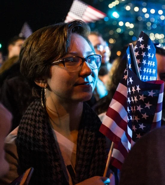 Mary Markovitz, of Connecticut, smiles while watching results come in early in the night at Hillary Clinton's Election Night Event outside the Jacob K. Javits Convention Center, New York, Nov. 8, 2016.