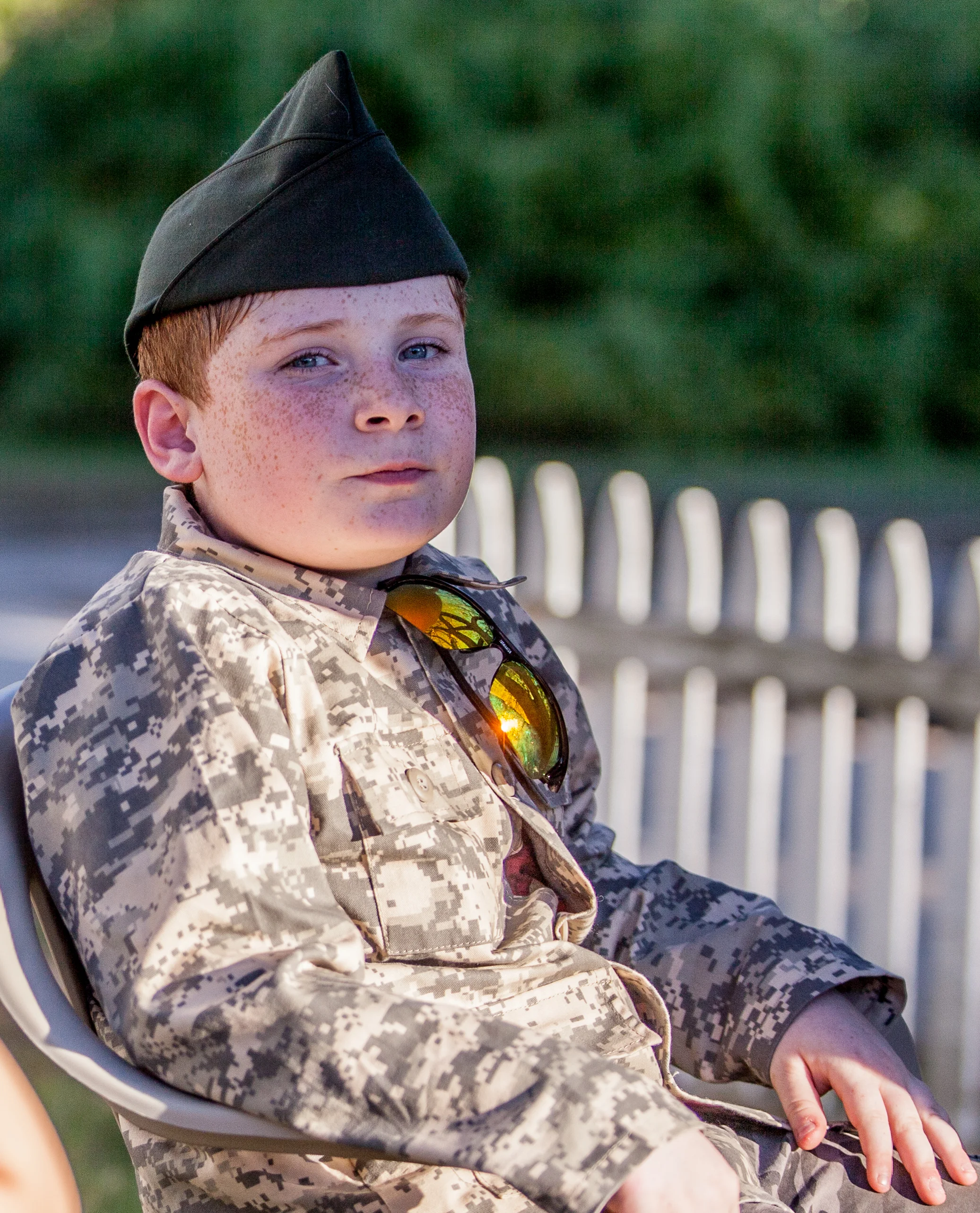 Evan Brewster poses for a portrait in his front yard in Sandown, New Hampshire, while waiting with his family to catch a glimpse of Donald Trump as he enters the Town Hall across the street for an invite-only event October 7. Brewster’s father is a veteran and a Trump supporter.