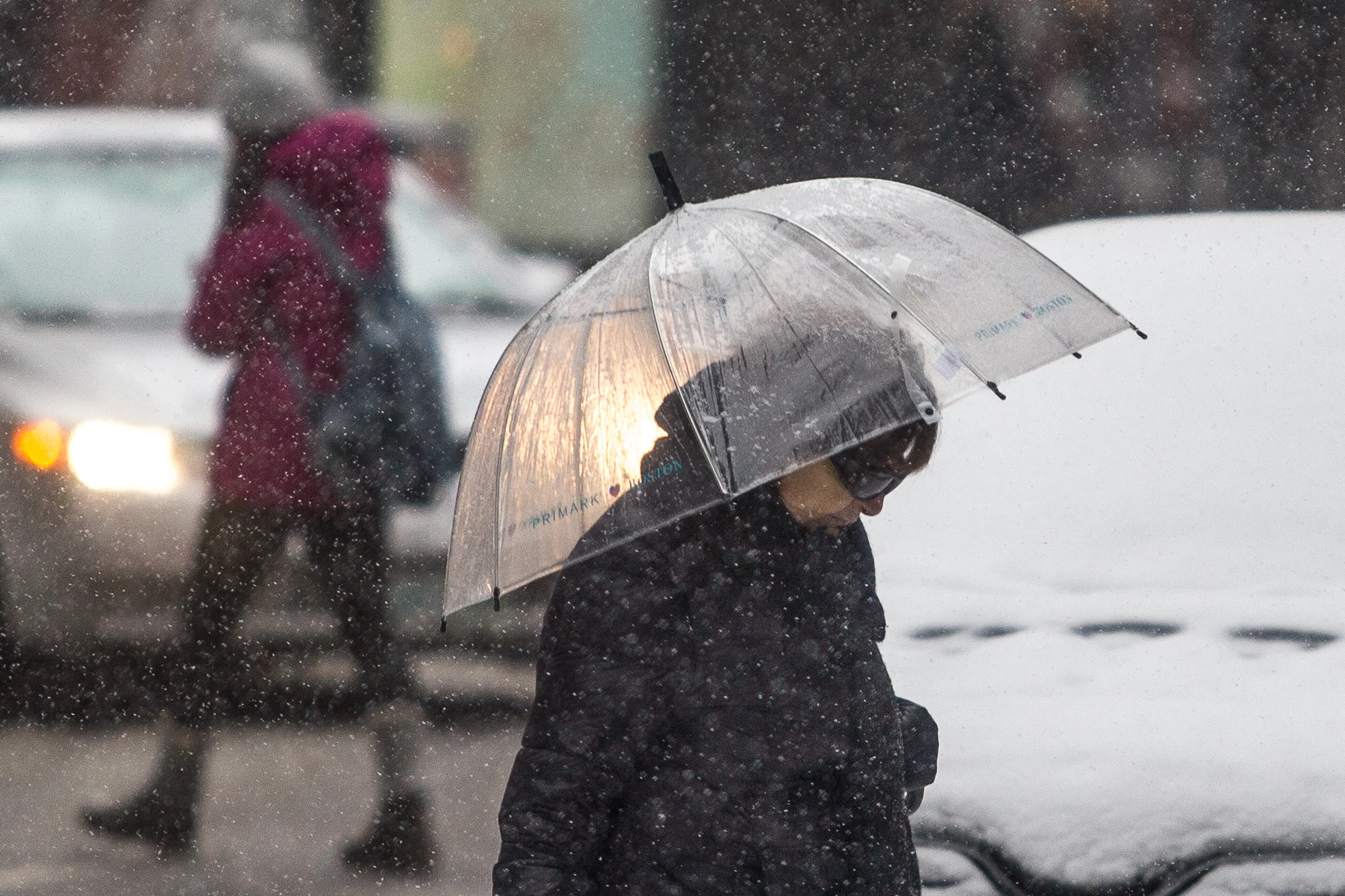 People walk through the streets of Downtown Boston on Dec. 17, 2016.