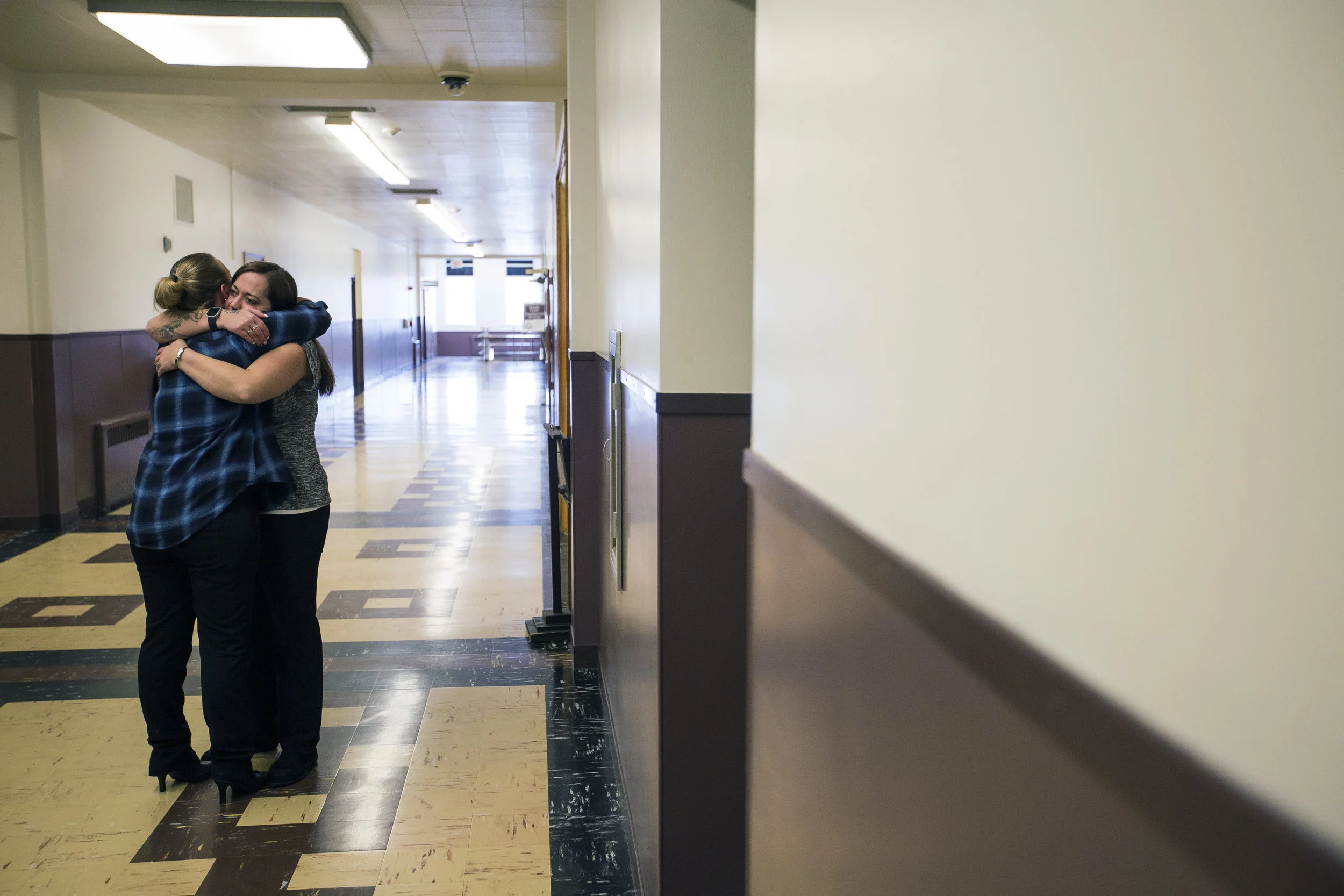 Cassandra Neinfeldt hugs a friend inside the Wood County Courthouse before her fiancé Kyle Keding's sentencing in Wisconsin Rapids, Wis., Monday, February 5, 2018. 