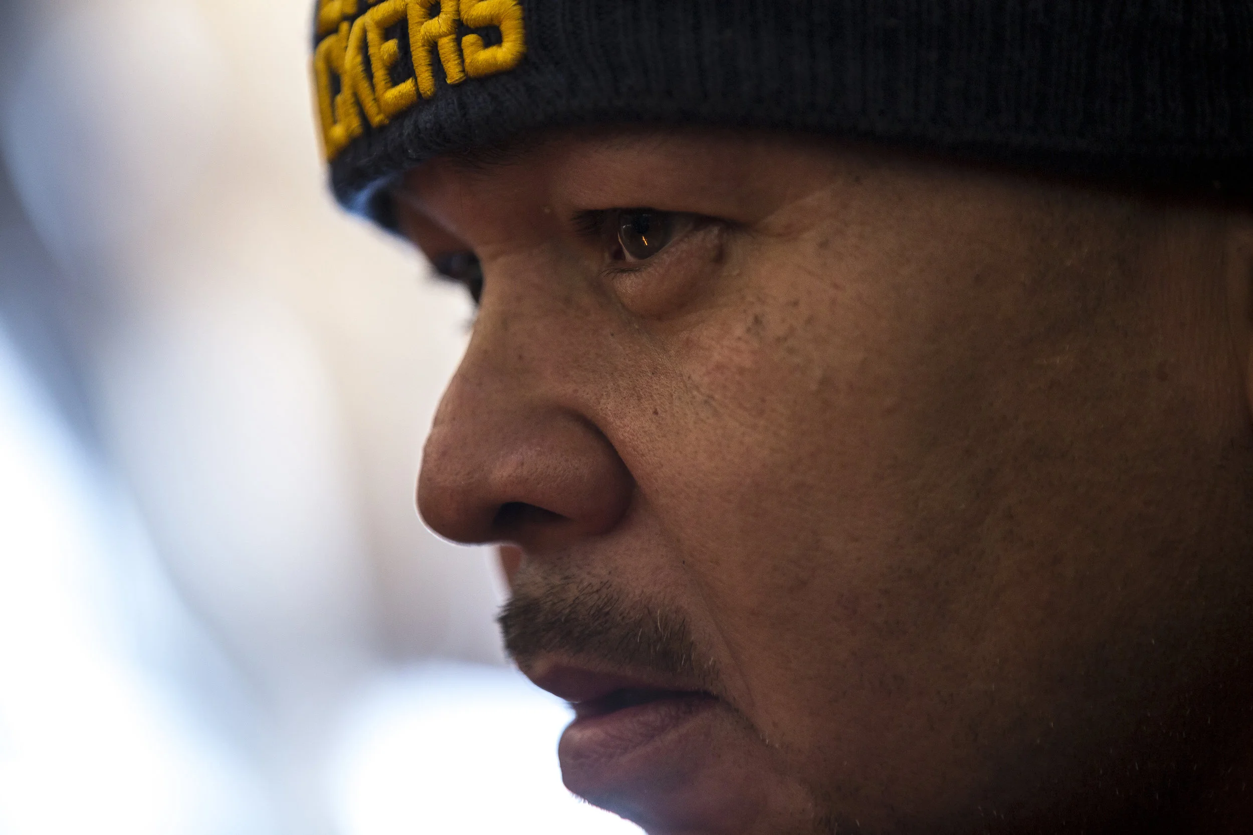Geronimo Powless, Joey Powless's father, watches the "sacred fire" in Oneida, Wis., Wednesday, December 13, 2017.