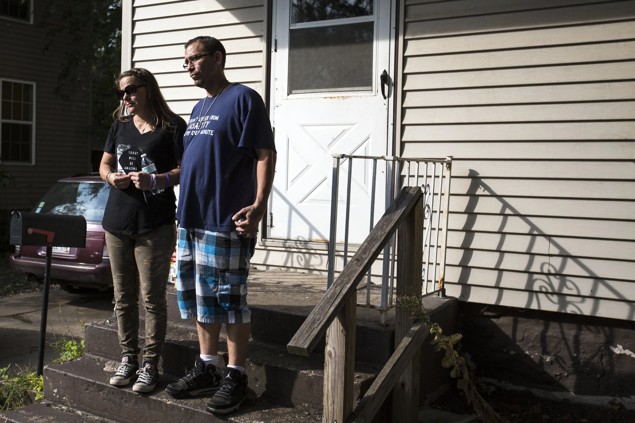 Palmieri and Lopez stand on their porch to say goodbye to friends from Narcotics Anonymous.