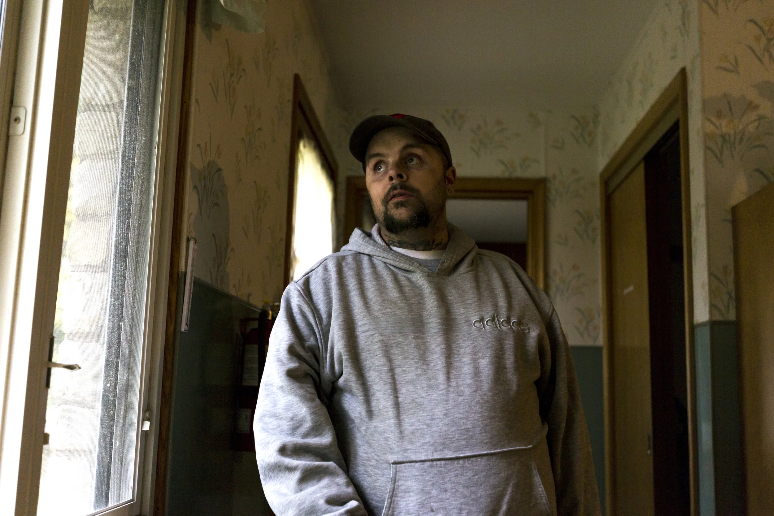 Kevin Williams looks out the window of the assisted-cate facility where he lives, in Wisconsin Rapids, October 23, 2017. Williams was incarcerated on drug-related charges when he found out he had a brain tumor. He suffered a stroke during the surgery to have it removed and lost some of his mobility. 