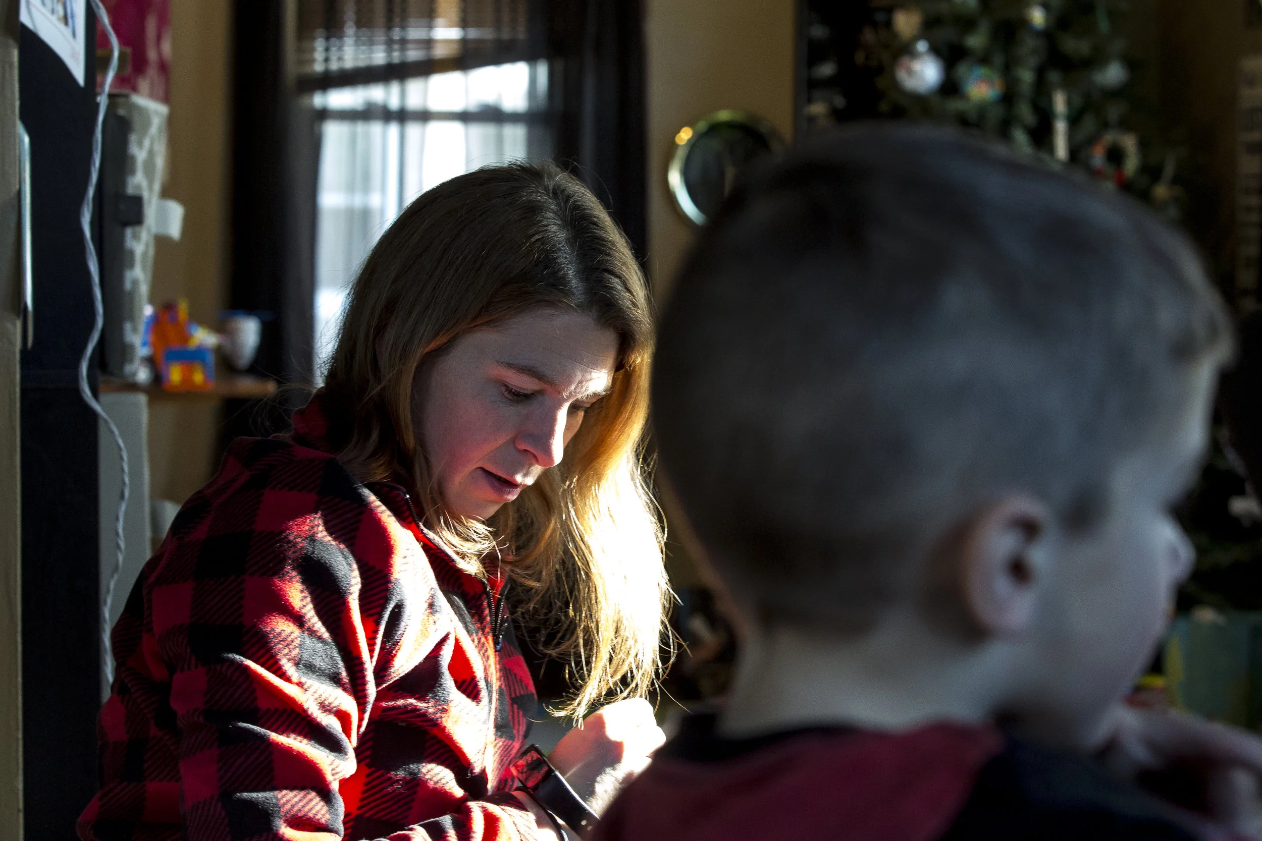 Scheer's wife Julie spends time with their son Bentley in their home in Fond du Lac. They were married throughout Scheer's drug use, but she said she didn't know just how heavily he was using.