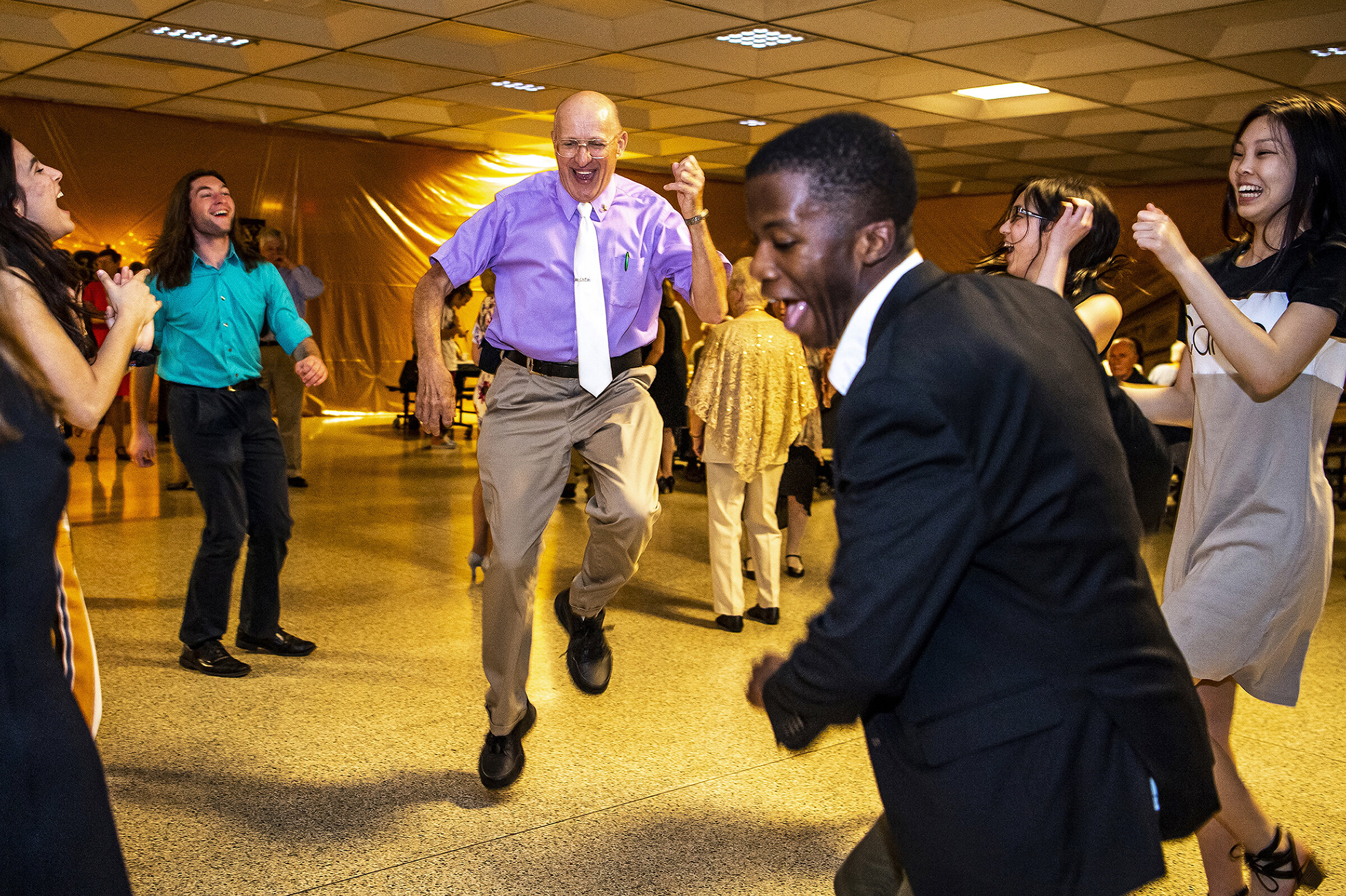  Phil Zmenkowski, of McCandless, Pa., center, dances with high school students during the annual prom for senior citizens hosted by North Allegheny Senior High School students, Friday, May 10, 2019, in the school's cafeteria in McCandless, Pa. 