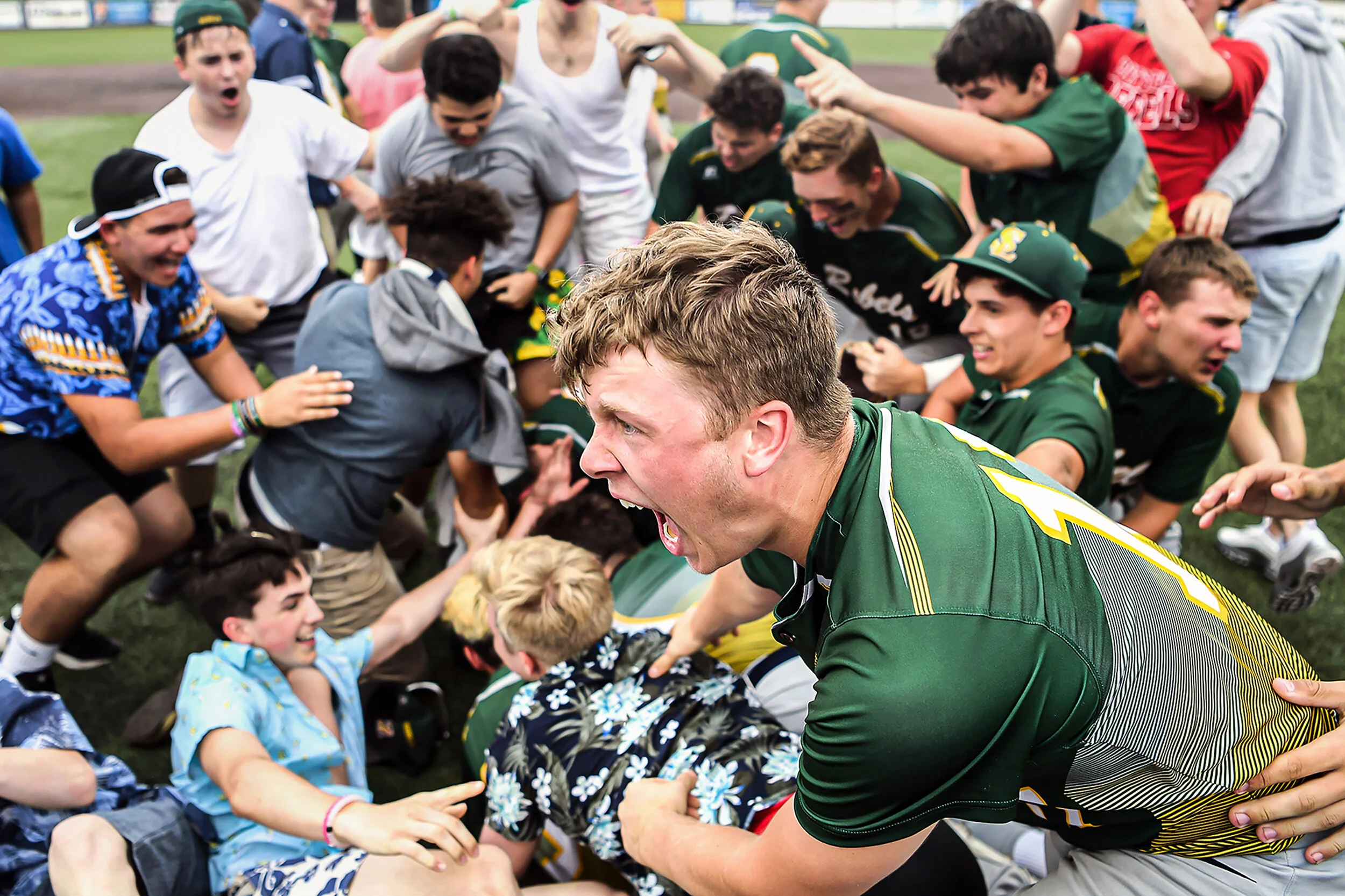  Seton LaSalle's Griffin Malloy, center, cheers as players and fans pile up on the field to celebrate their 11-2 victory over Serra Catholic in the WPIAL Class 2A championship, Wednesday, May 29, 2019, at Consol Energy Park in Washington, Pa. 