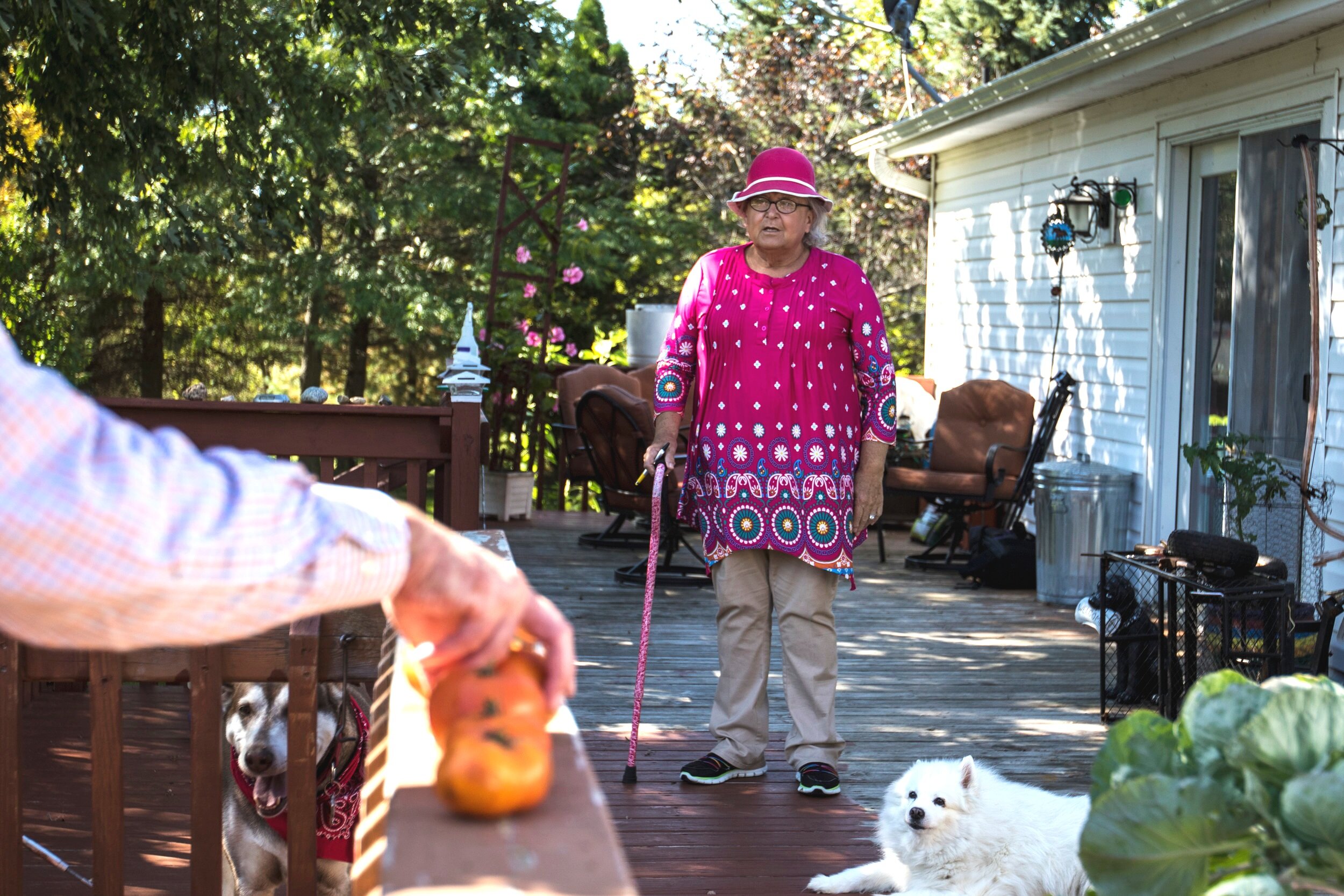 Carla Steinke, a transgender woman, talks to her son Robert Steinke as he picks tomatoes from their garden in the town of Plover, Wis. on Tuesday, September 19, 2017. Robert Steinke became an activist for transgender rights after his parent experien