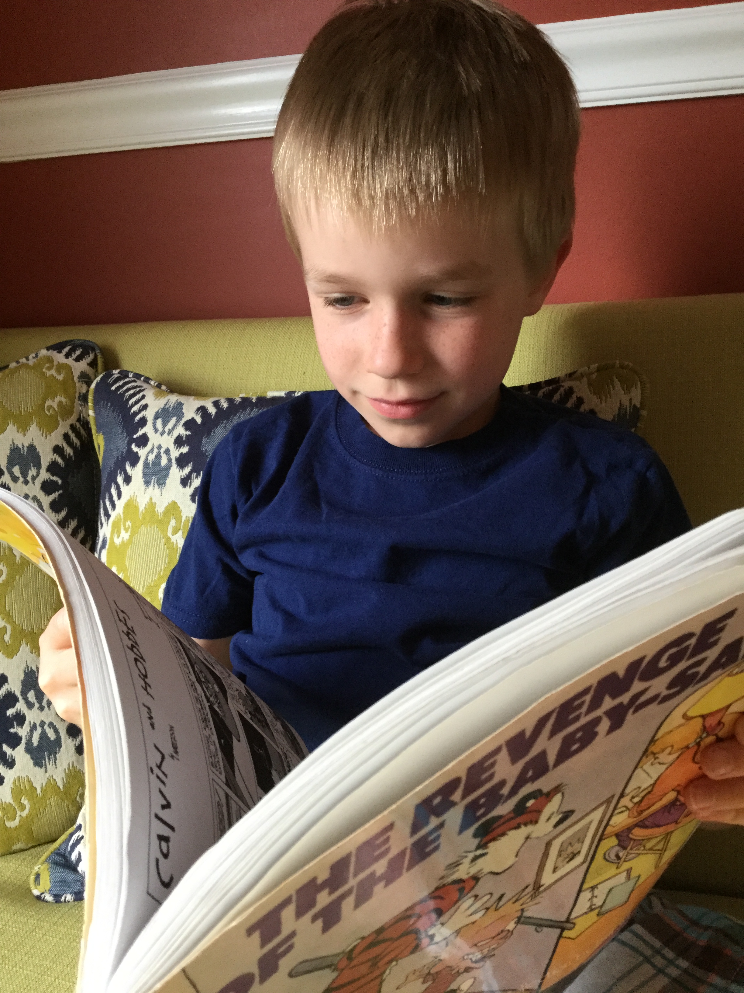 My 7-year-old with his new favorite book series.