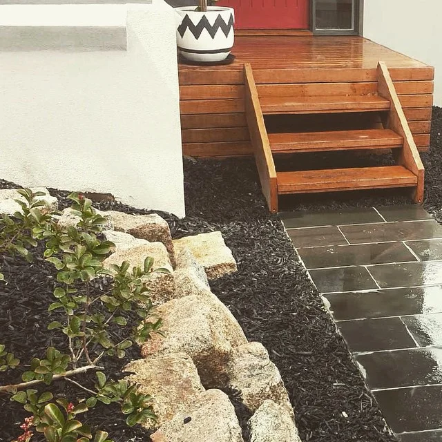 Simplicity is best. Low maintenance, cost efficient rock retainer and bluestone paving at St Kilda East project.