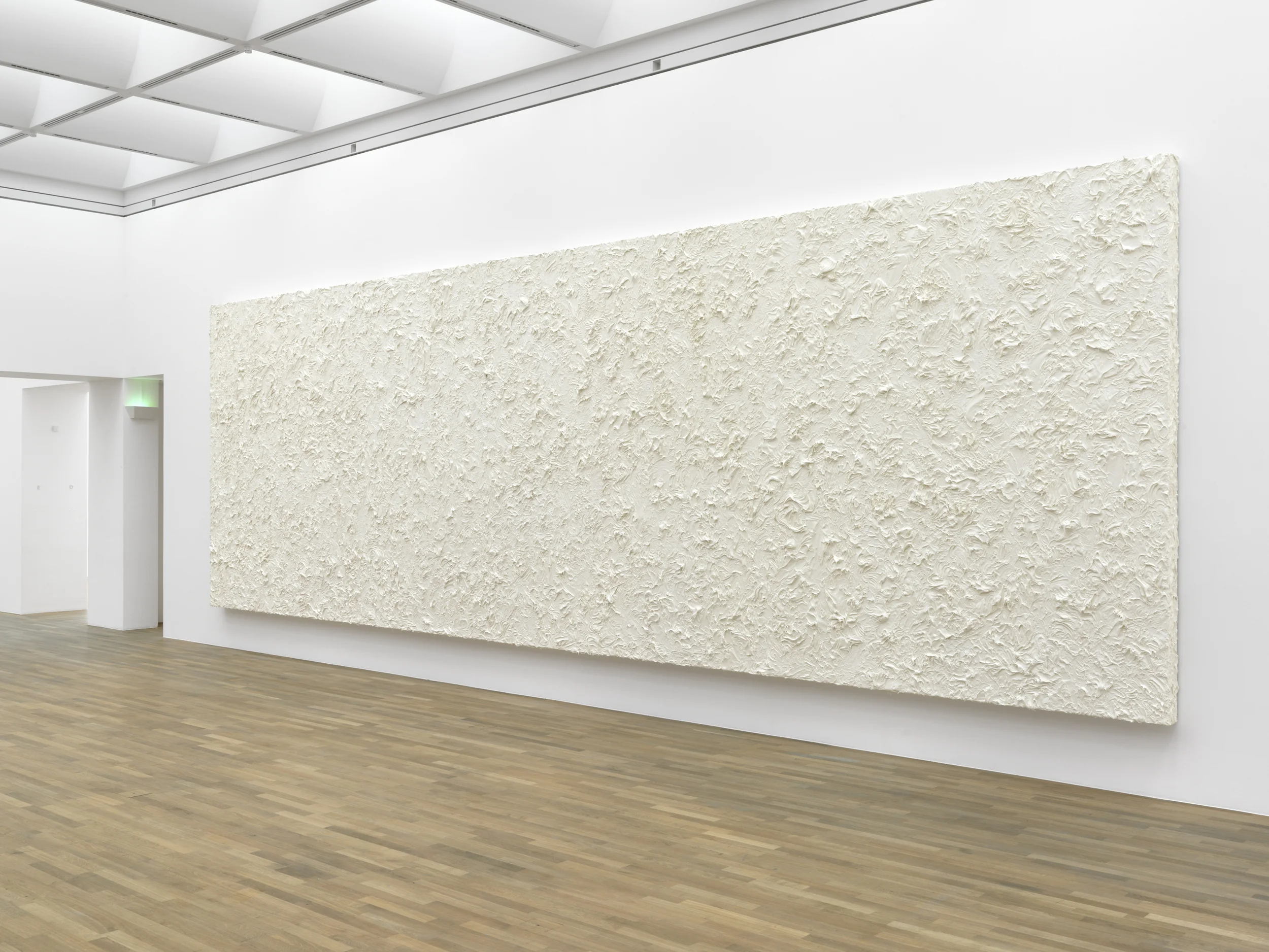 Untitled, 2011, Penaten baby cream on laminated chipboard, 350 x 1100 x 16 cm