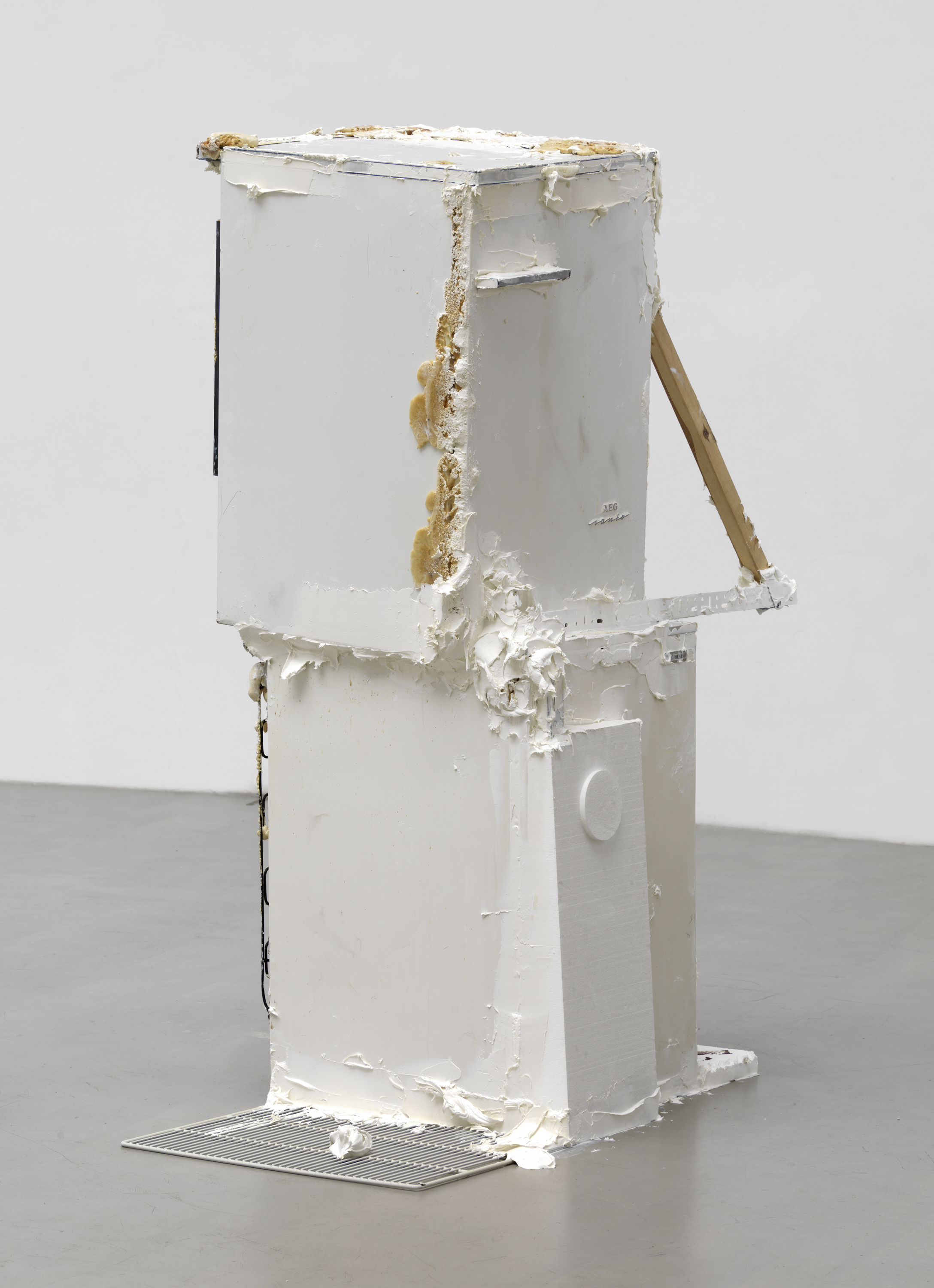 Untitled (version 2), 2014, refrigerators, polyurethane foam, Penaten baby cream, Styrofoam, plastic, wood, wire, chocolate biscuits, Nutella, 175 x 440 x 220 cm