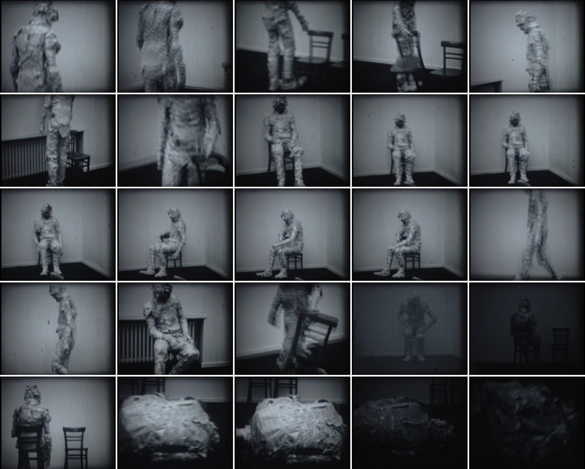 Man Made of Newspaper or the Possibilities for Communication performance at Student's Cultural Centre Gallery, Belgrade, Serbia. 1973, 8 mm, silent movie, b/w movie